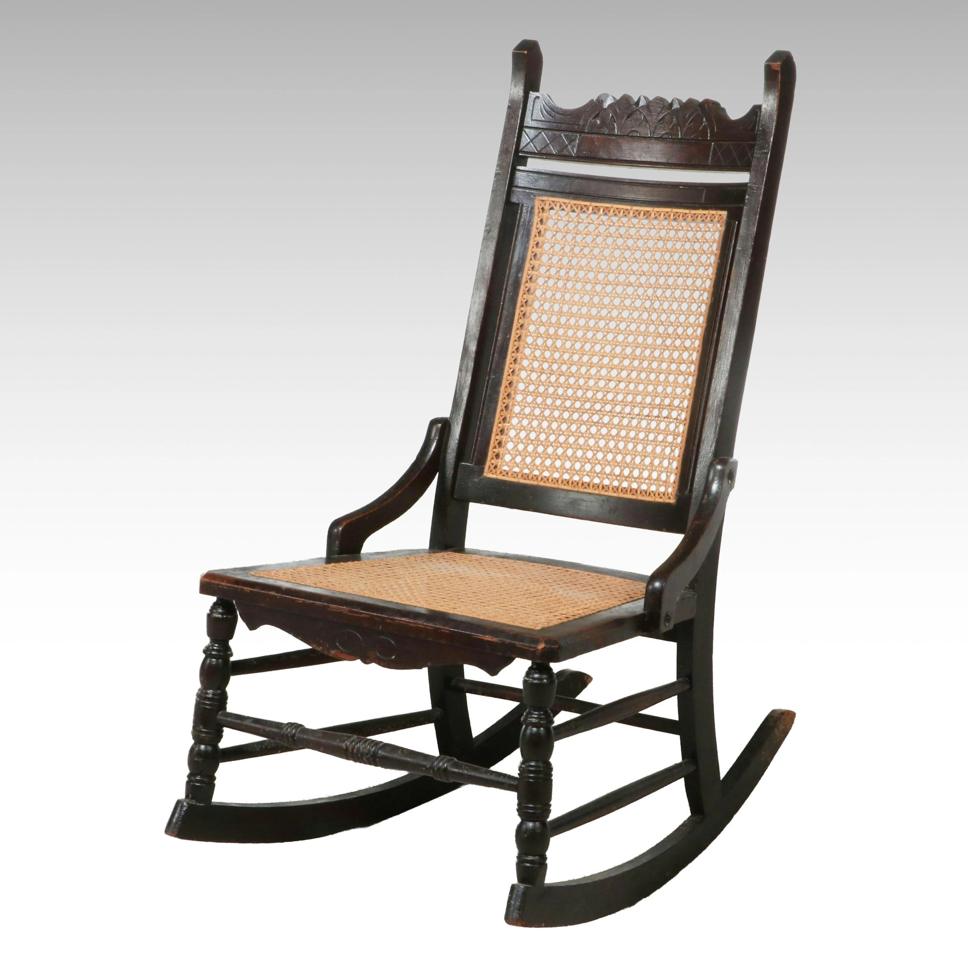 Eastlake Style Ebonized Wood and Cane Rocking Chair, Late 19th to Early 20th C.