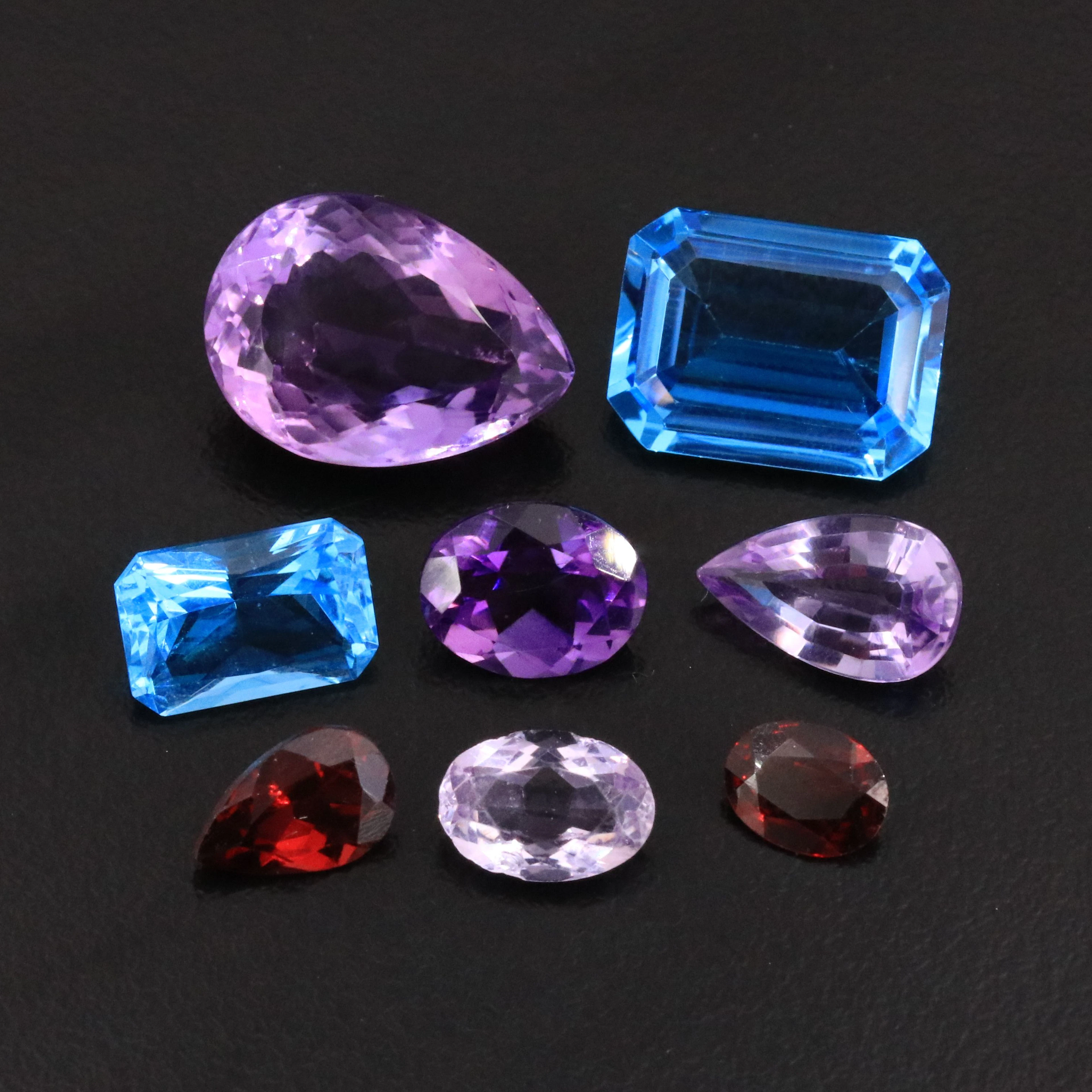 Loose 38.76 CTW Amethyst, Topaz, and Garnet Lot