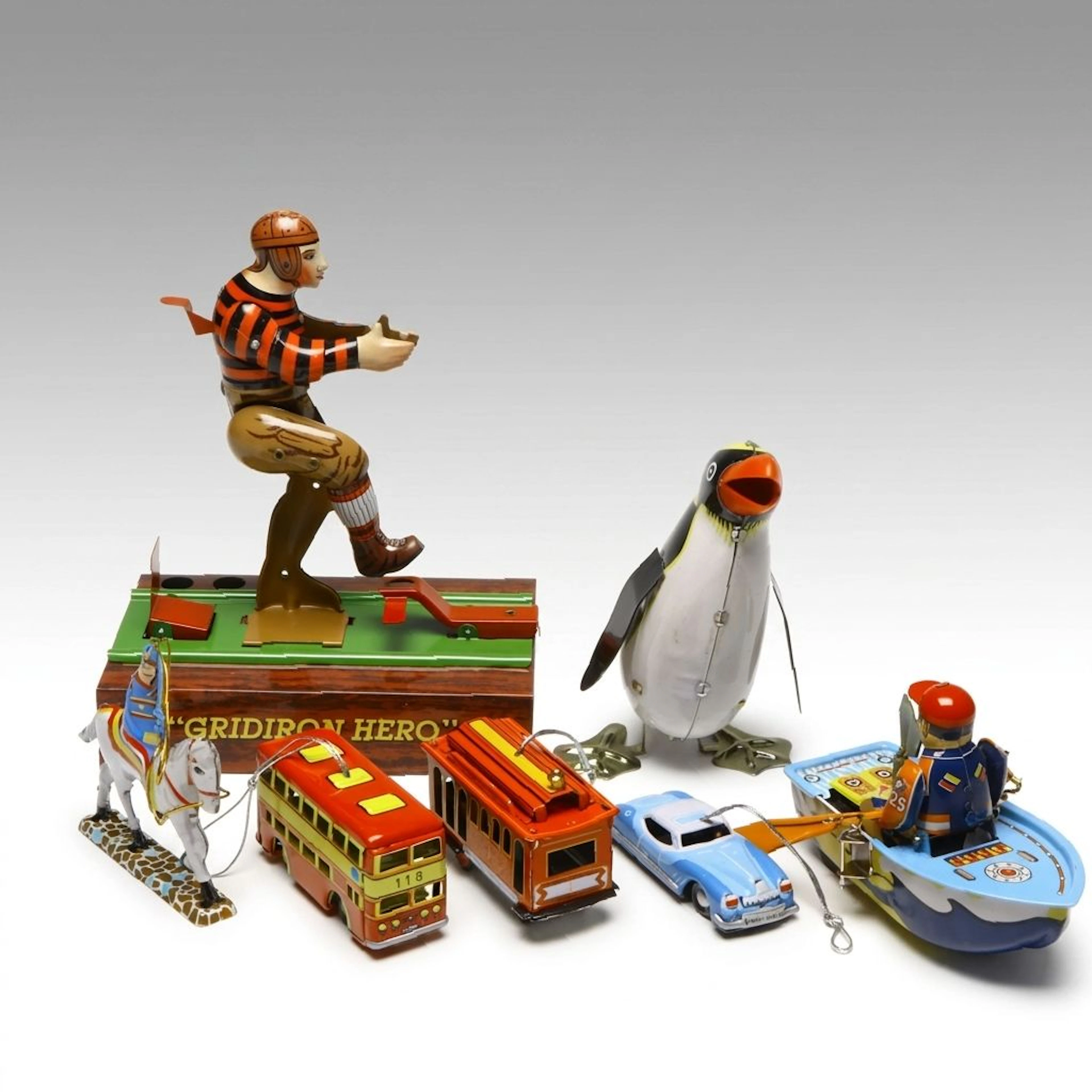 Schylling "Gridiron Hero" Toy with "Horseman" Ornament and More Tin Toys, 1990s