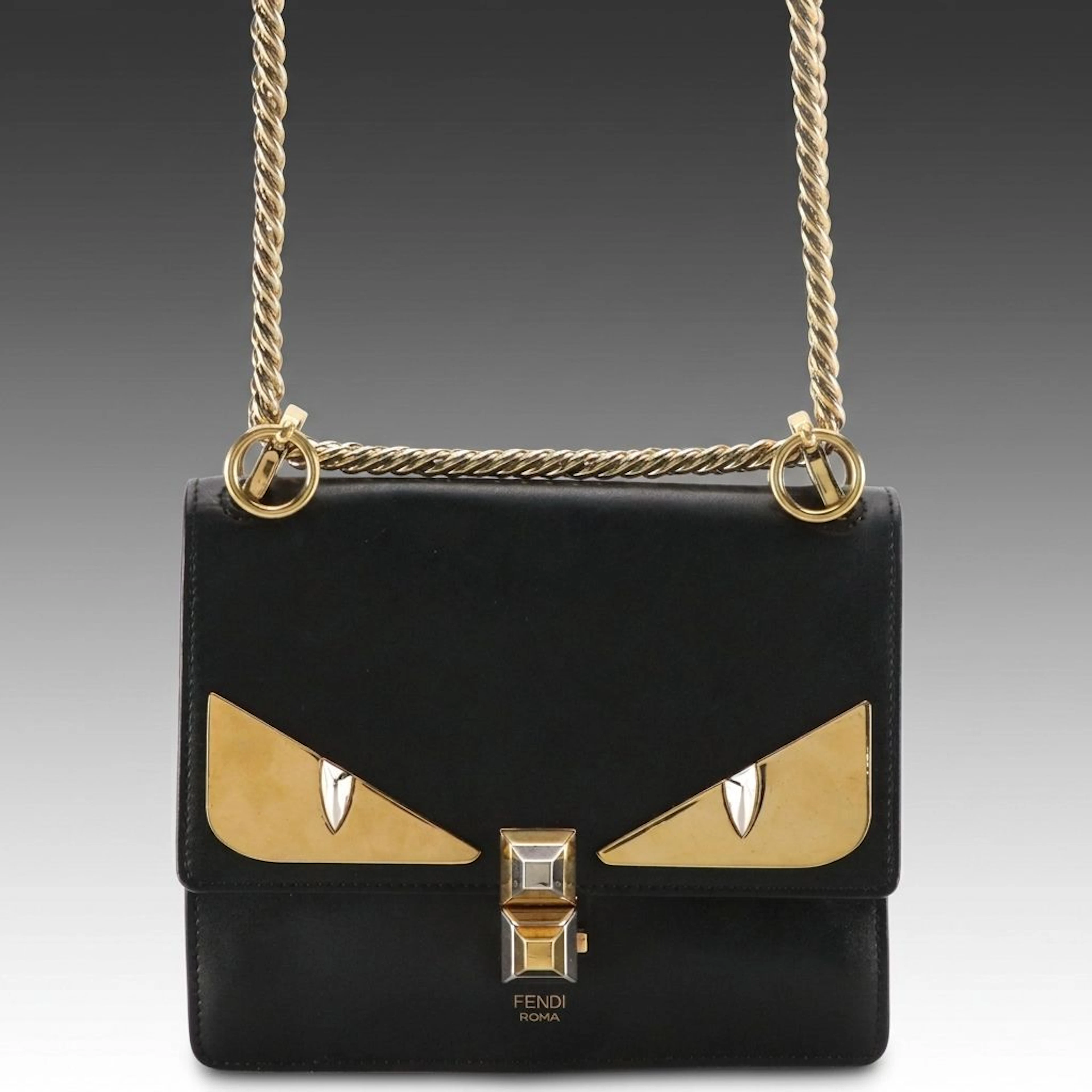 Fendi Kan Monster Eyes Crossbody Bag in Black Leather and Mixed Metal