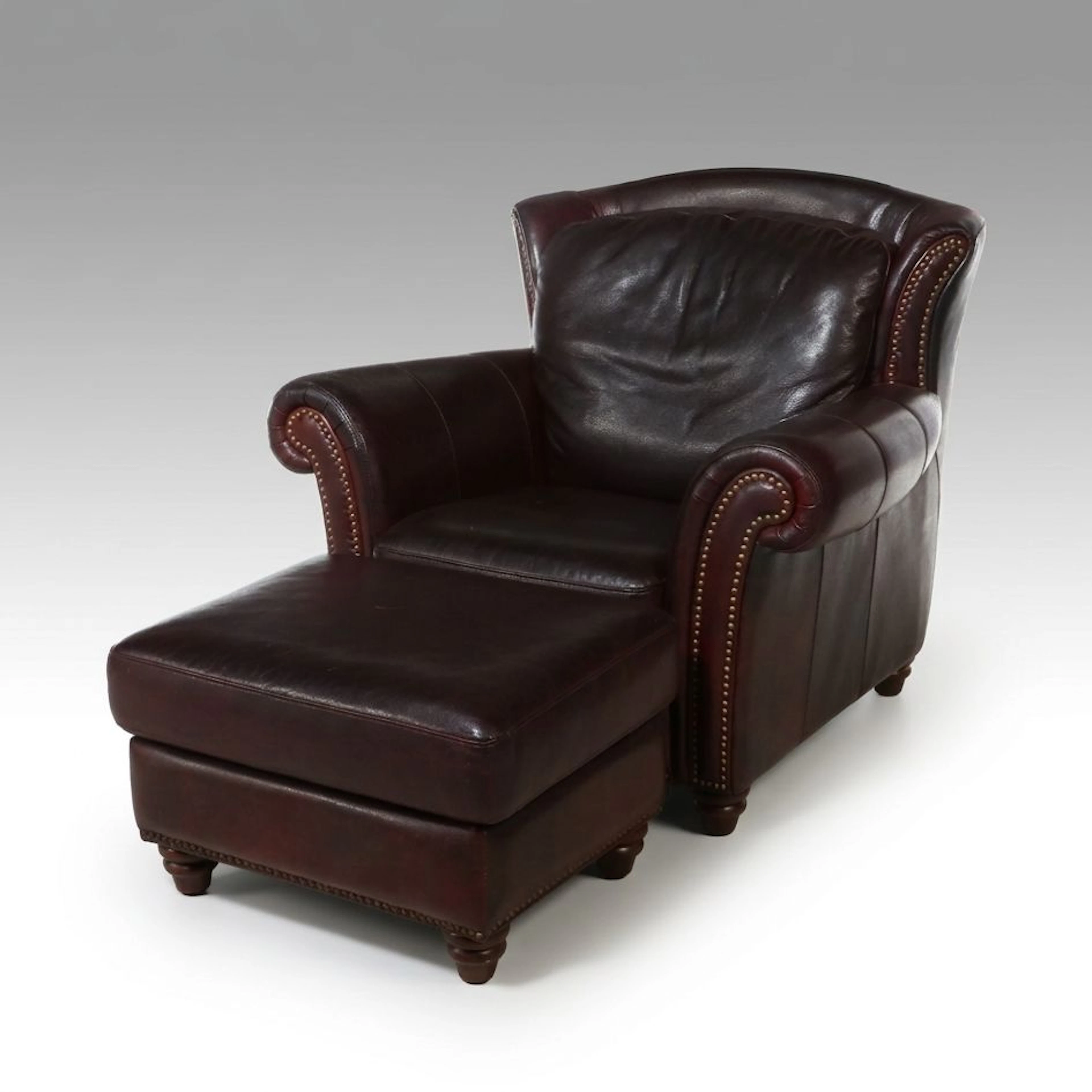 Flexsteel Faux Leather Lounge Chair with Nailhead Trim and Ottoman