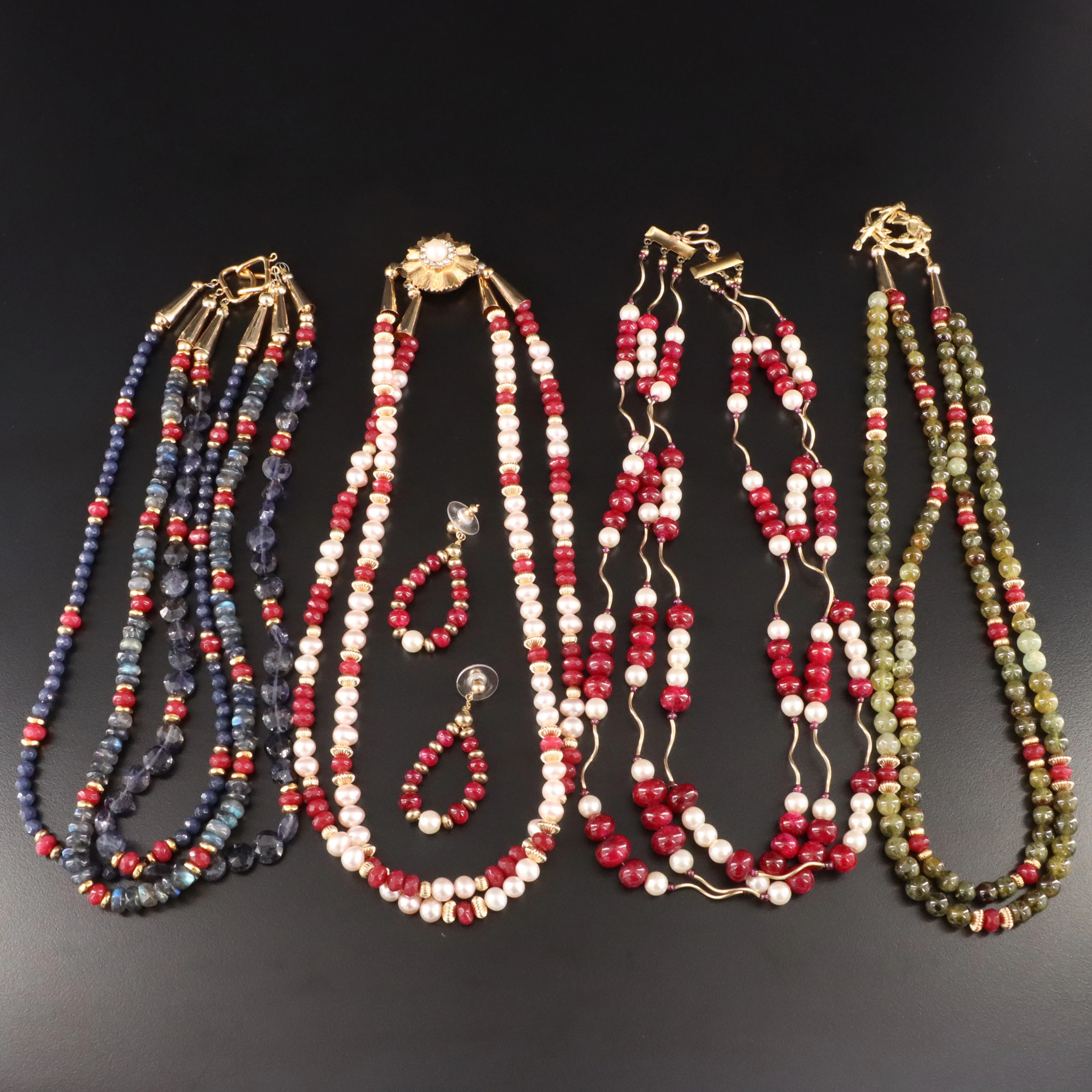 Ruby, Iolite and Grossularite Garnet Featured in Tiered Necklaces and Earrings