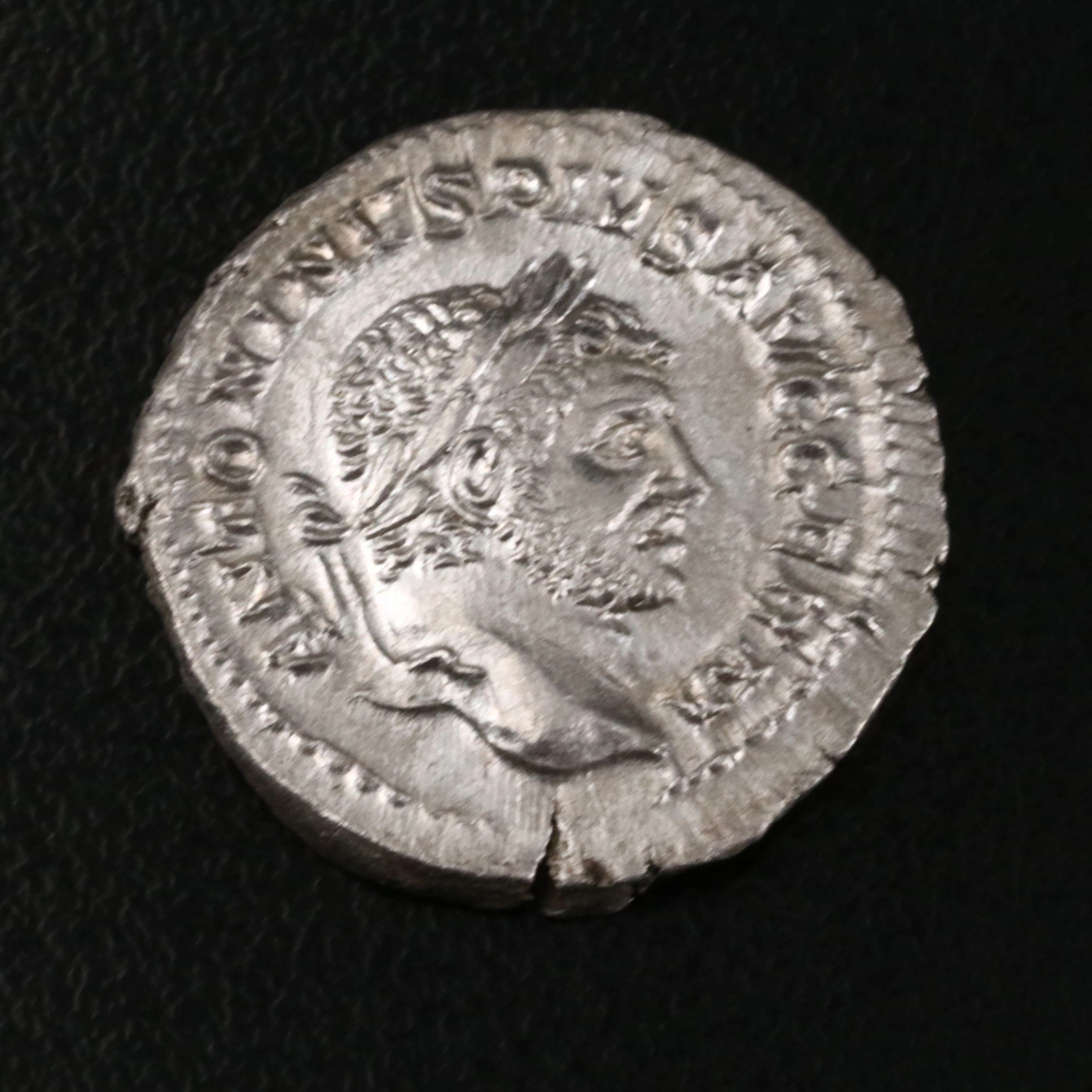 Ancient Roman Imperial AR Denarius Coin of Caracalla, ca. 215 A.D.