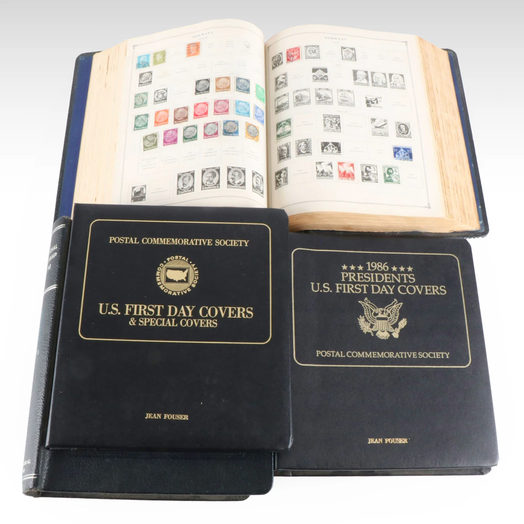 Four Stamp Albums 2 with U.S. and World Stamps, and 2 with U.S First Day Covers