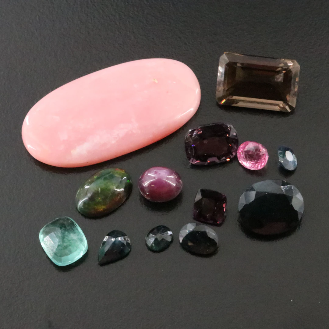 Loose 50.51 CTW Gemstone Lot Featuring Opal, Star Ruby and Pink Sapphire