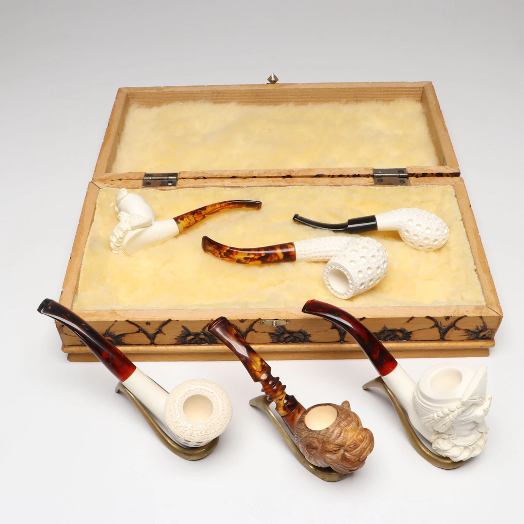 Sultan Head and Other Carved Meerschaum Pipes with Brass Pipe Stands and Box