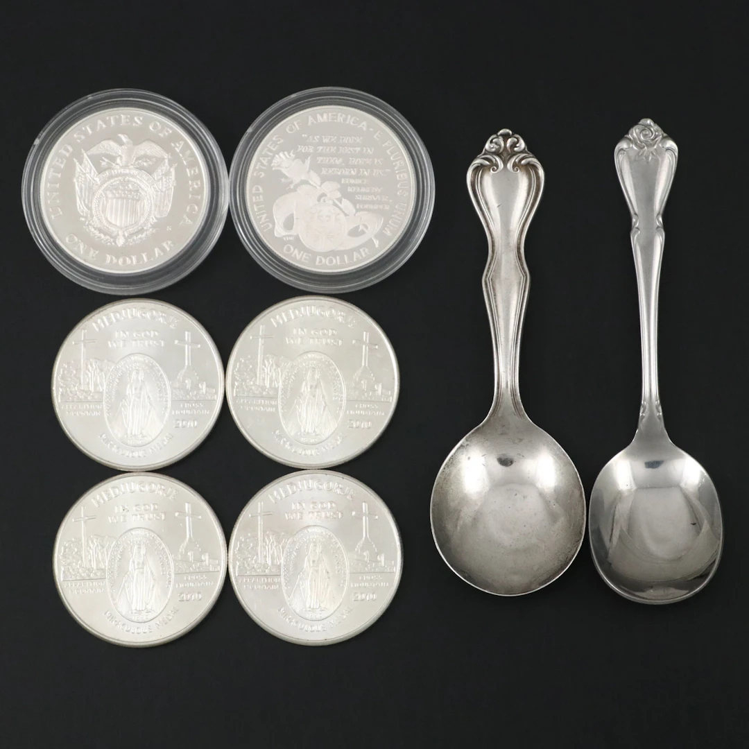 Four Silver Rounds, Two Modern Commemorative Dollars, and a Silver Spoon