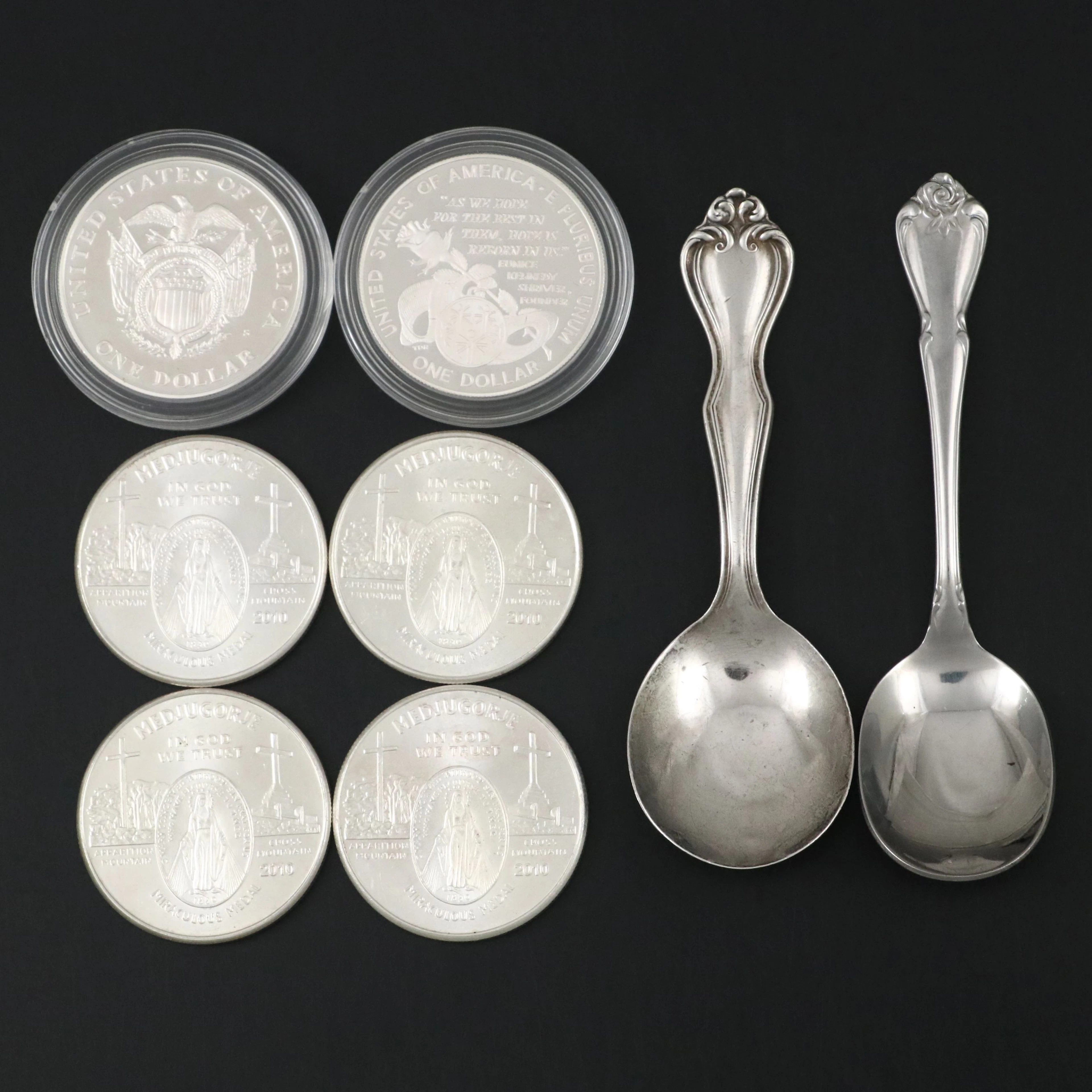 Four Silver Rounds, Two Modern Commemorative Dollars, and a Silver Spoon