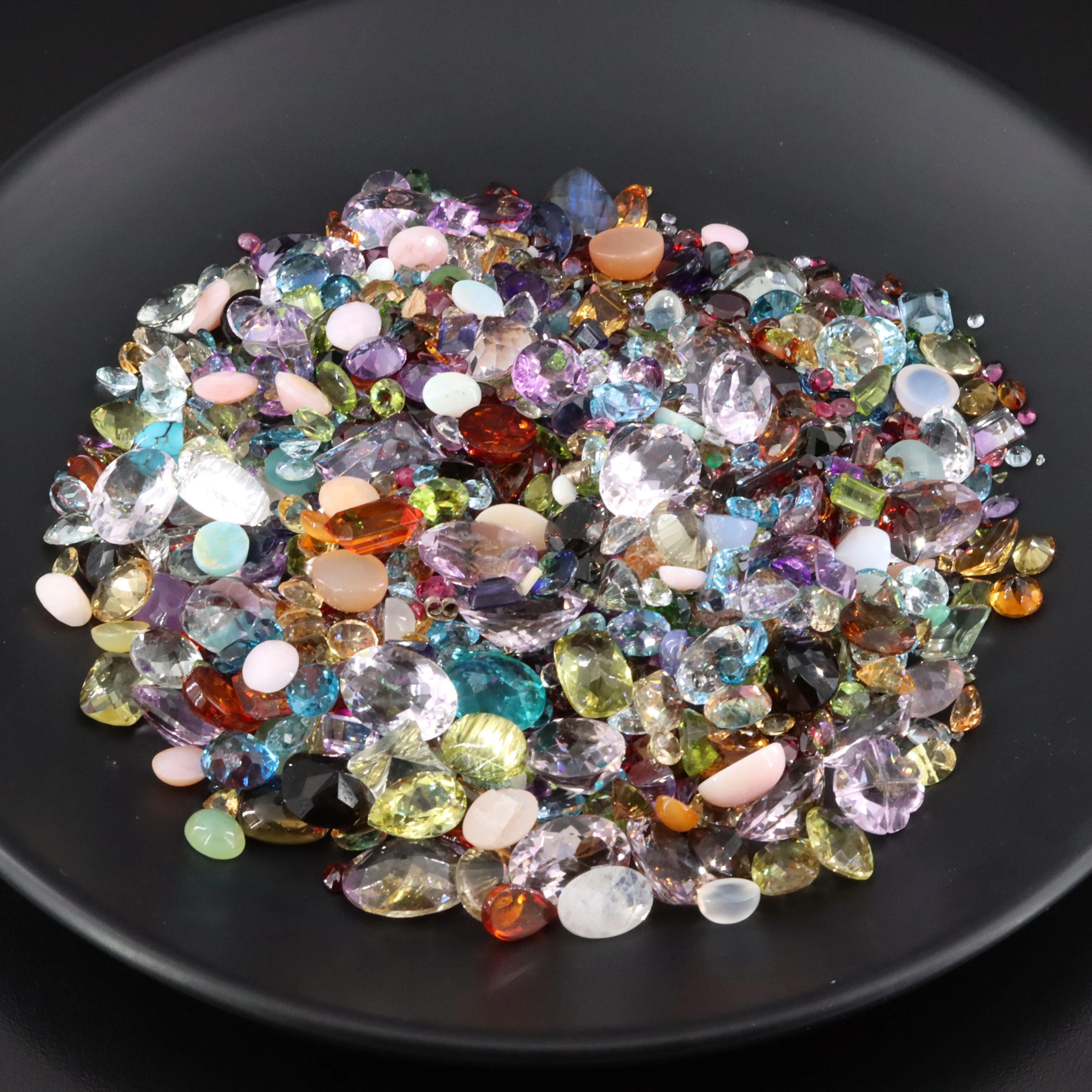 Loose 1954.50 CTW Mixed Gemstone Lot Featuring Topaz, Amethyst and Quartz