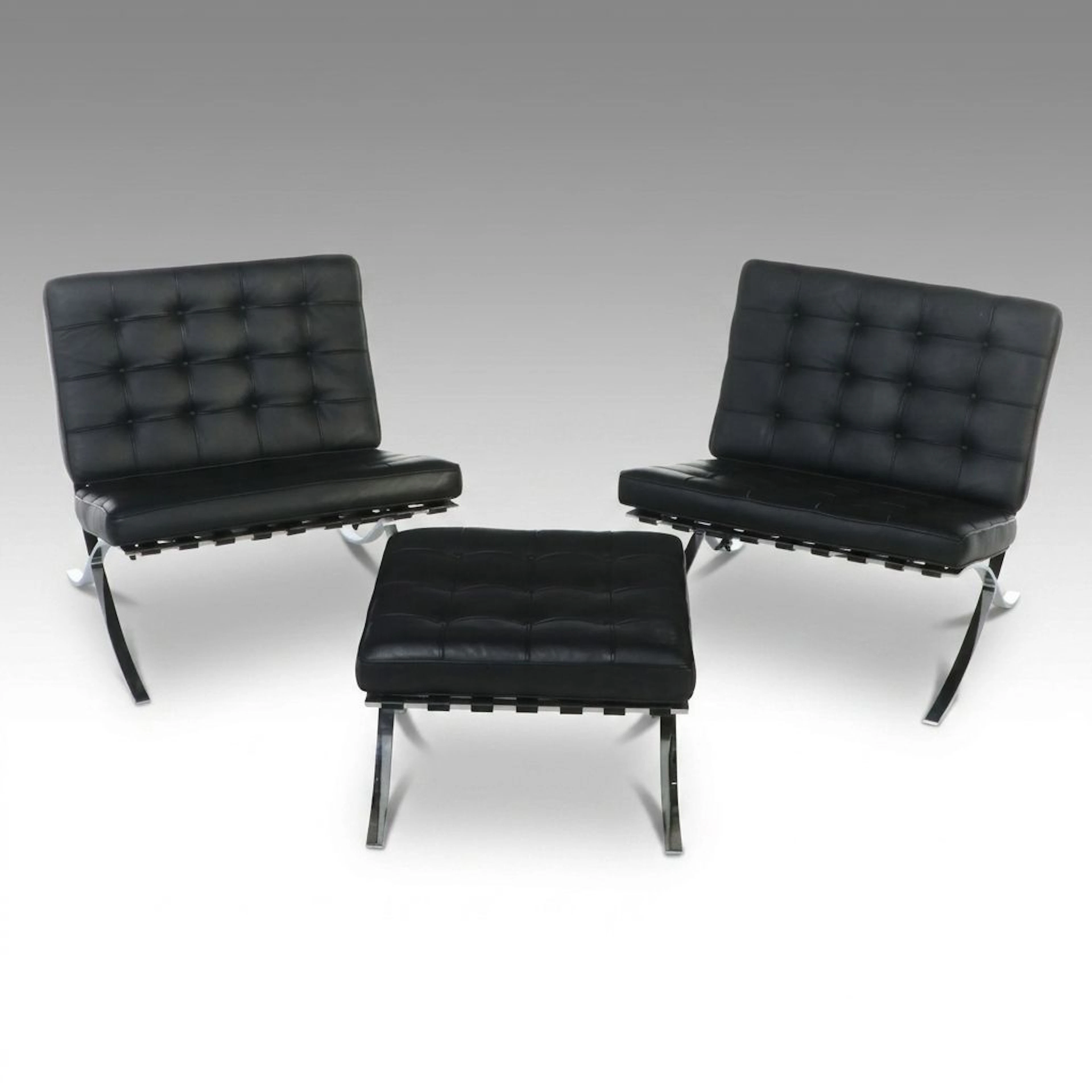 Pair of Barcelona Style Black Leather and Chrome Lounge Chairs and Ottoman