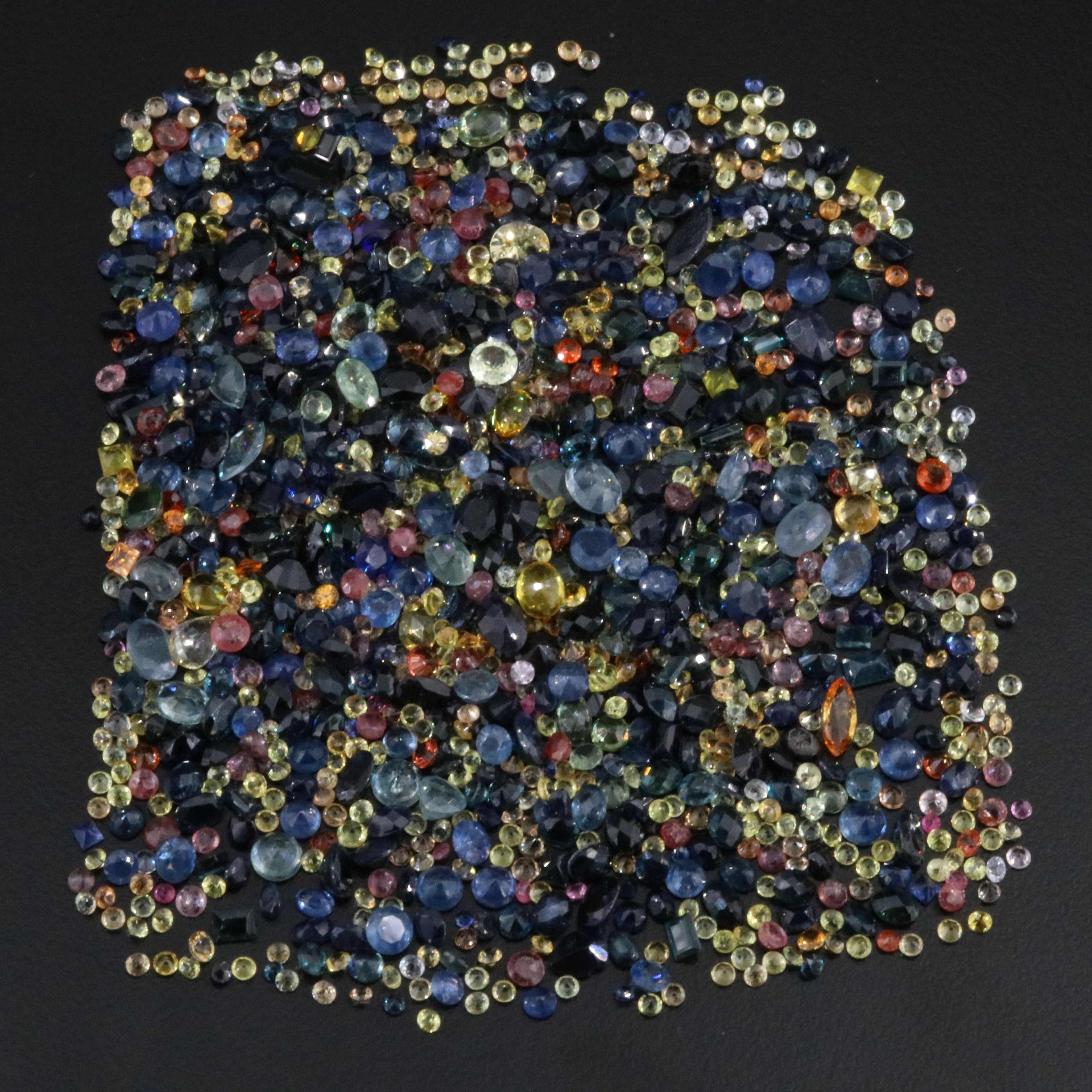 Loose 143.51 CTW Gemstone Lot Featuring Sapphire, Ruby, and Topaz