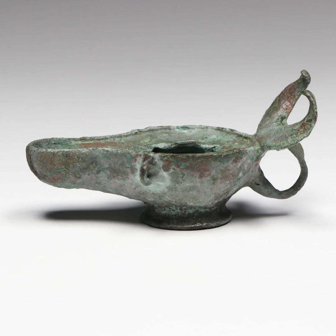 Roman Bronze Oil Lamp with Crescent Handle, Circa 1st–3rd Century CE