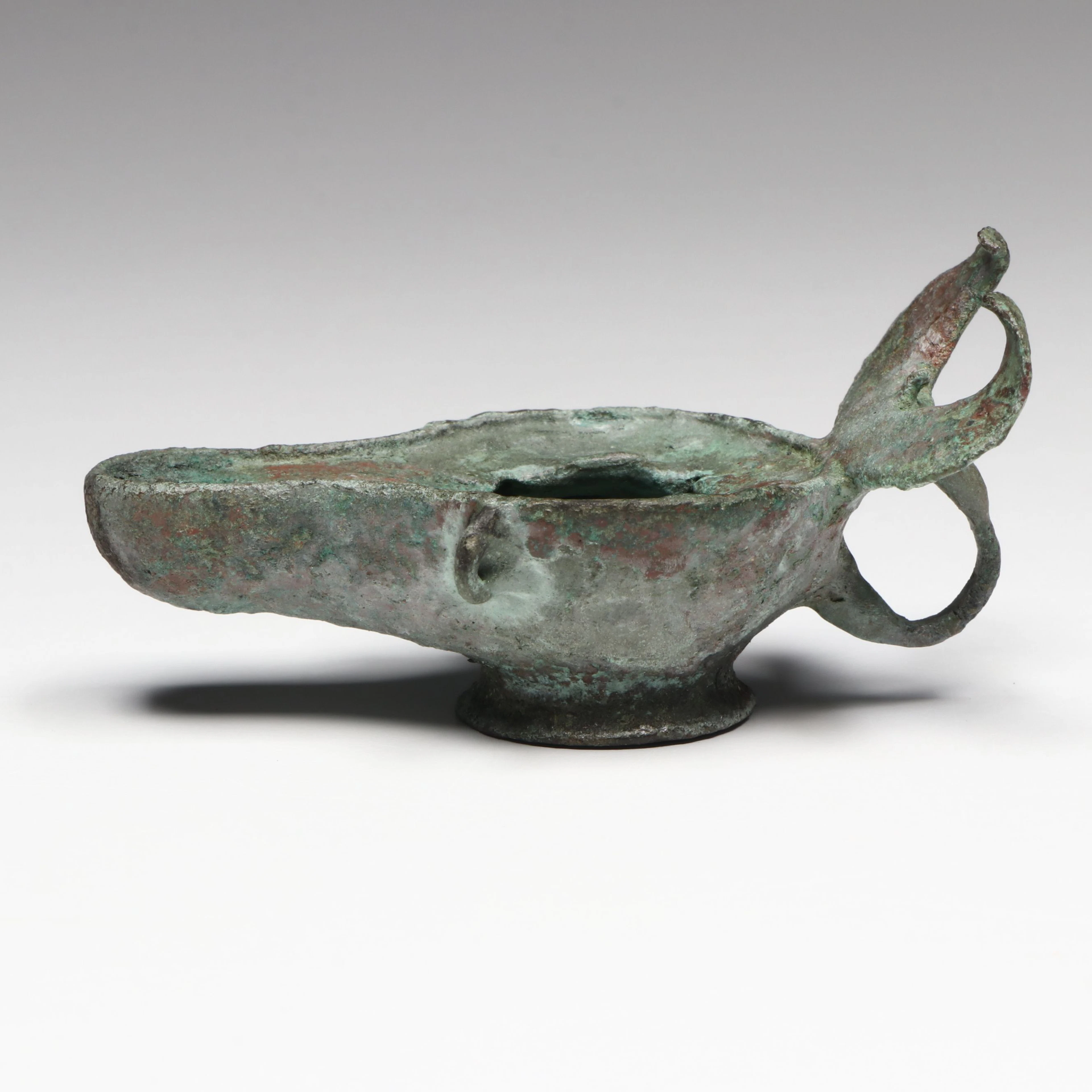 Roman Bronze Oil Lamp with Crescent Handle, Circa 1st–3rd Century CE
