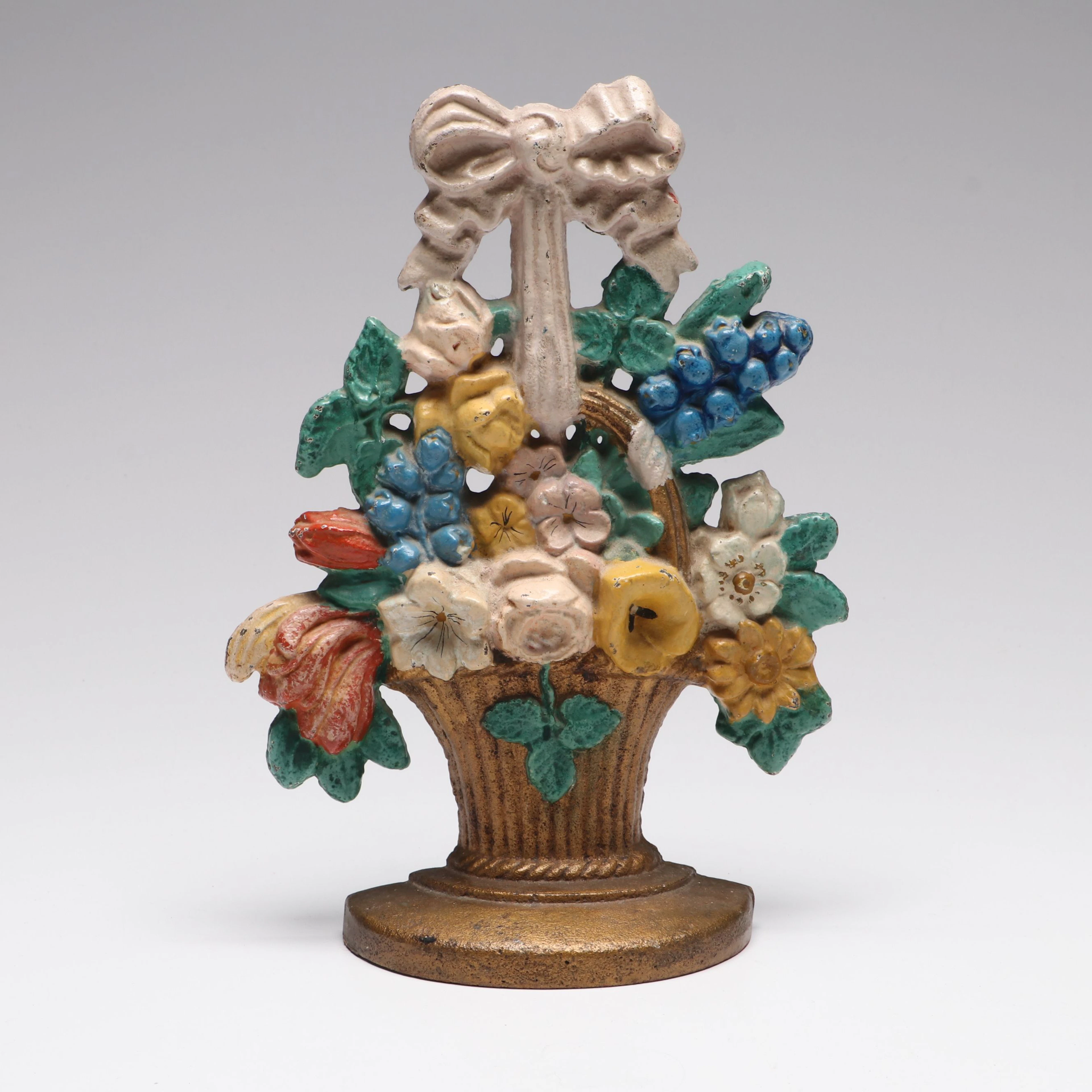 Painted Cast Iron Spring Floral Doorstop, Early 20th Century