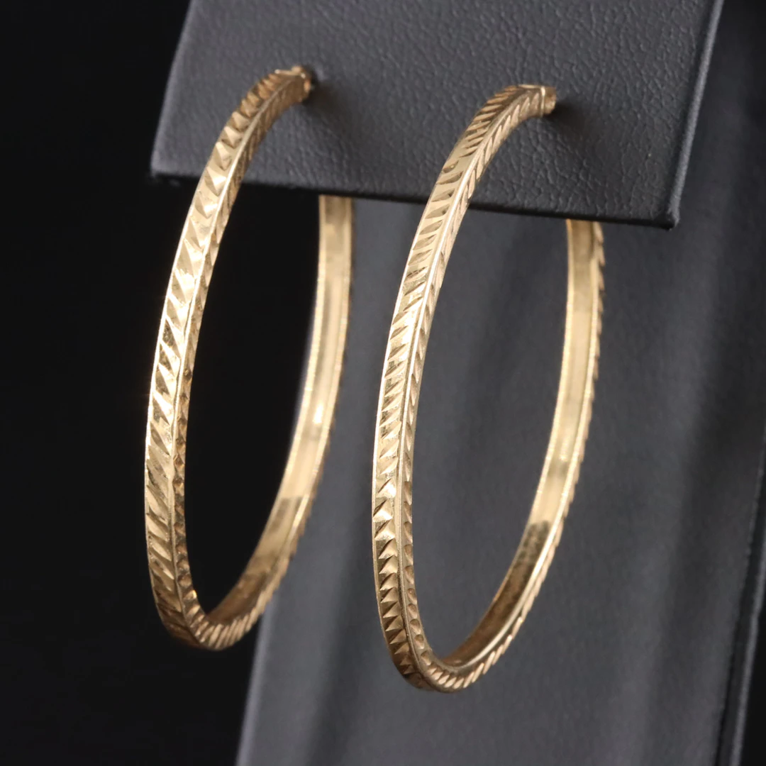 14K Oval Hoop Earrings with Diamond-Cut Finish