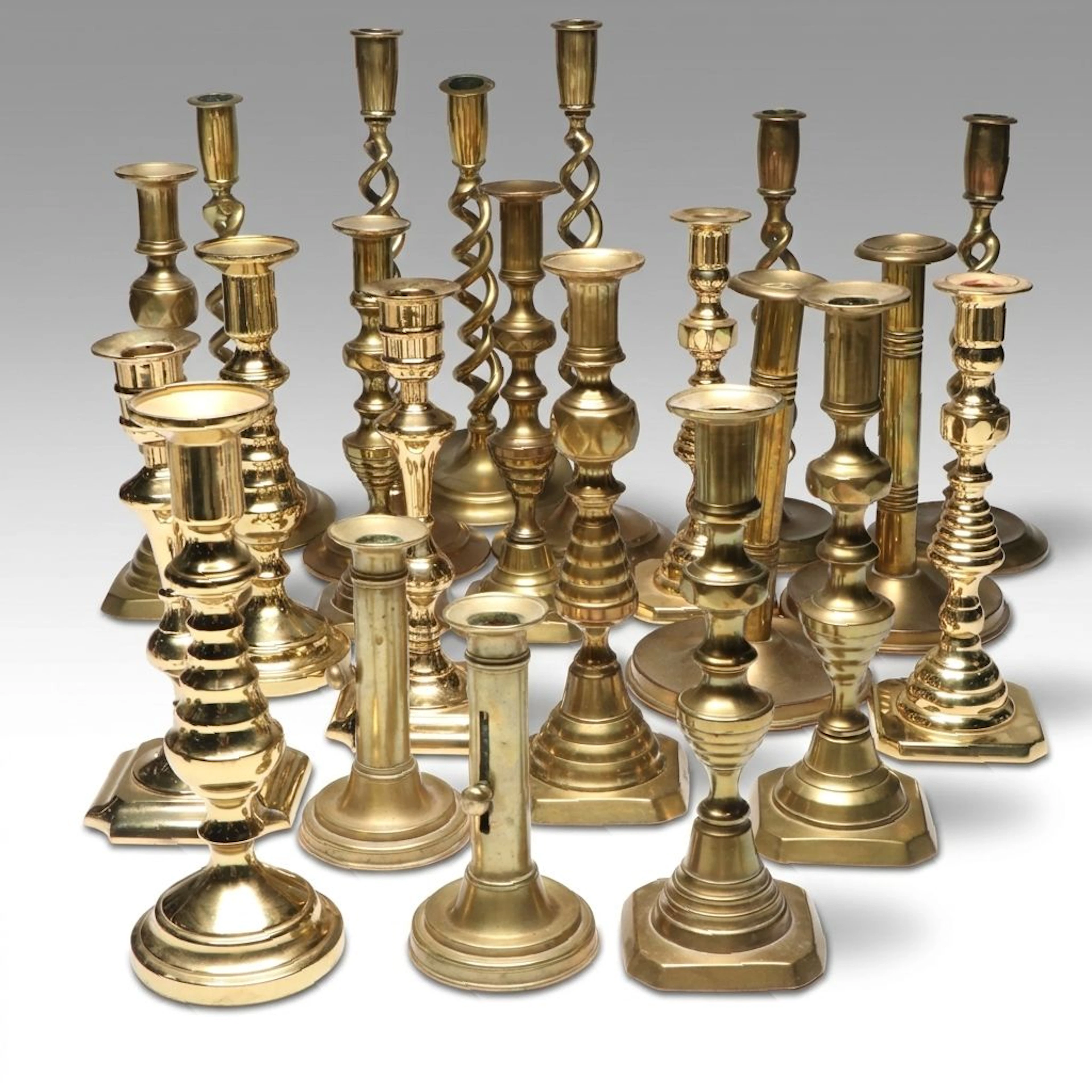Pair of Valsan Gilded Candlesticks with Other Brass Candle Holders