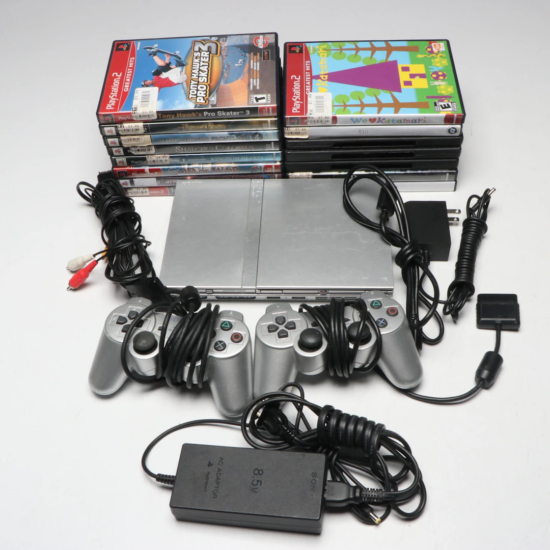 Sony PlayStation 2 with Controllers and Video Games