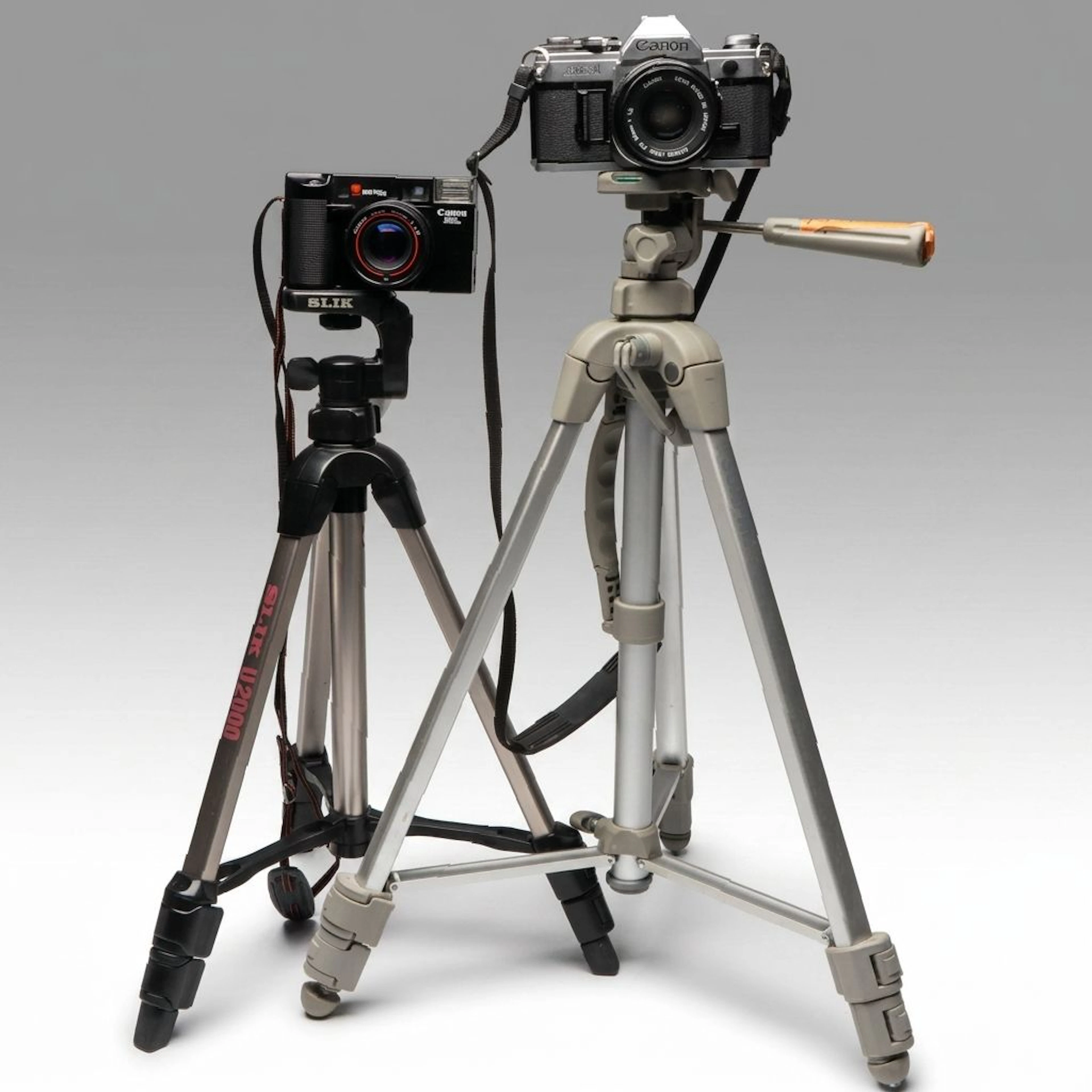 Canon AE-1 and Canon ML Film Cameras with Tripods