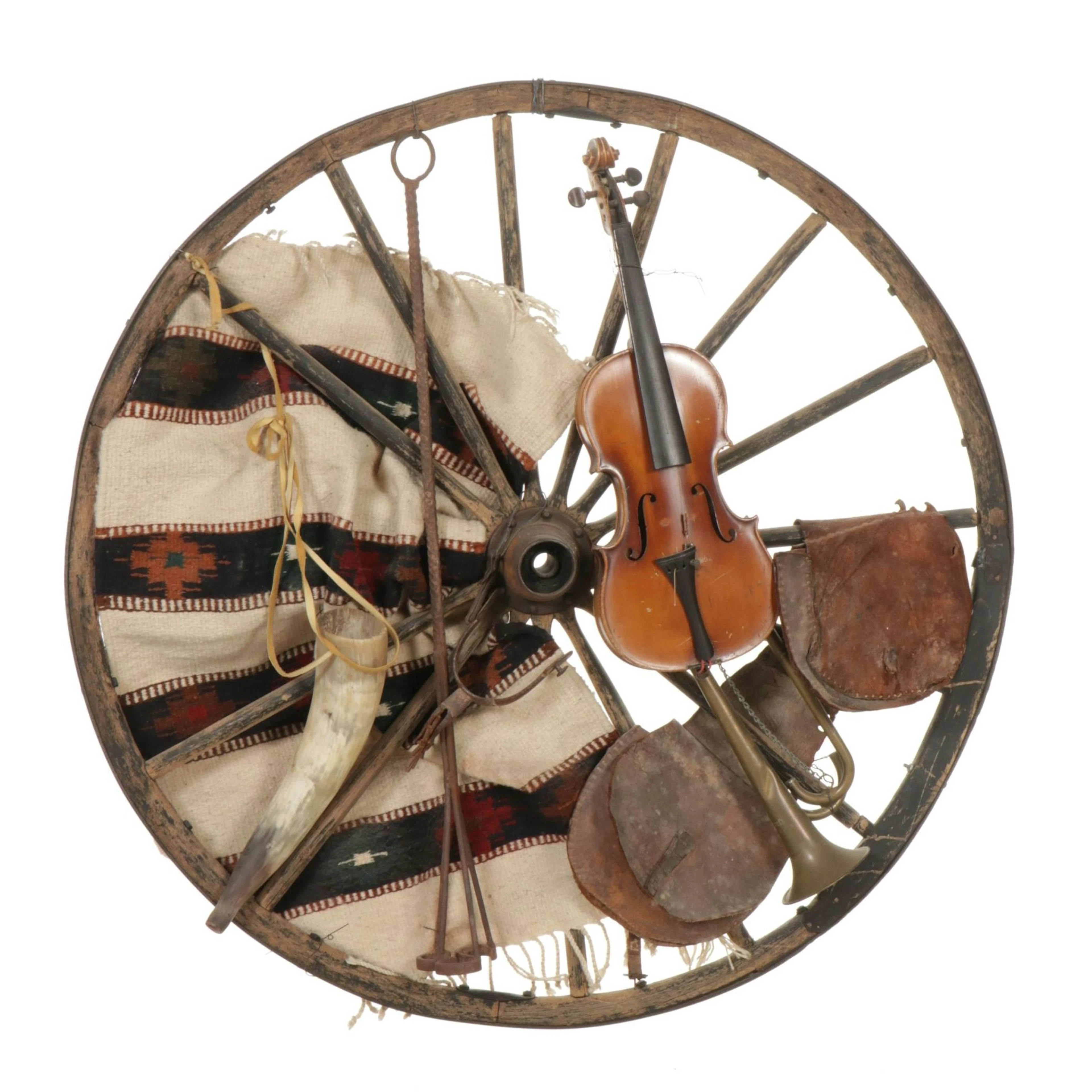 Wooden Wagon Wheel Adorned with Violin, Horn, Leather Pouch, Fabric, & More