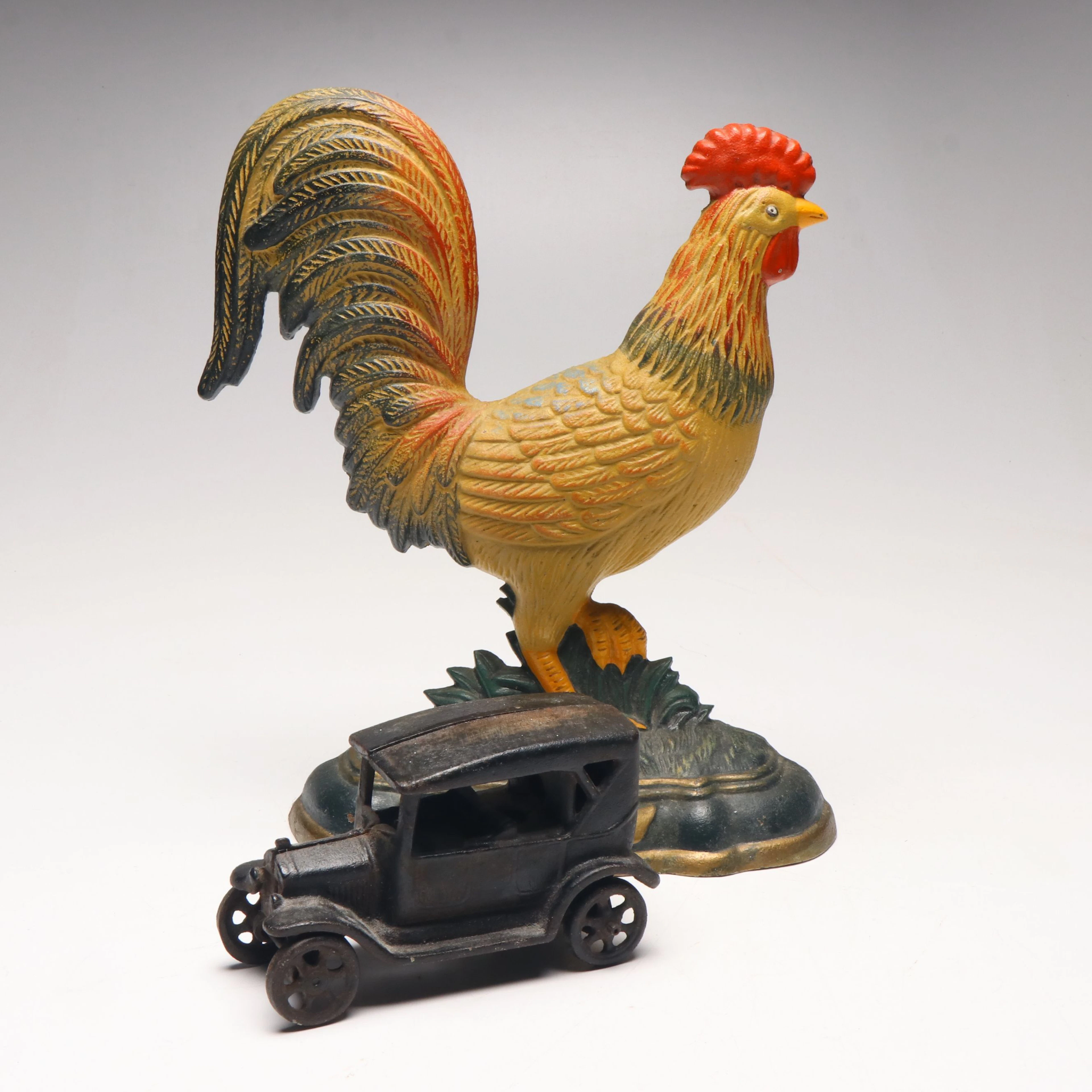 Polychrome Cast Iron Rooster Doorstop and Cast Iron Model Ford Toy