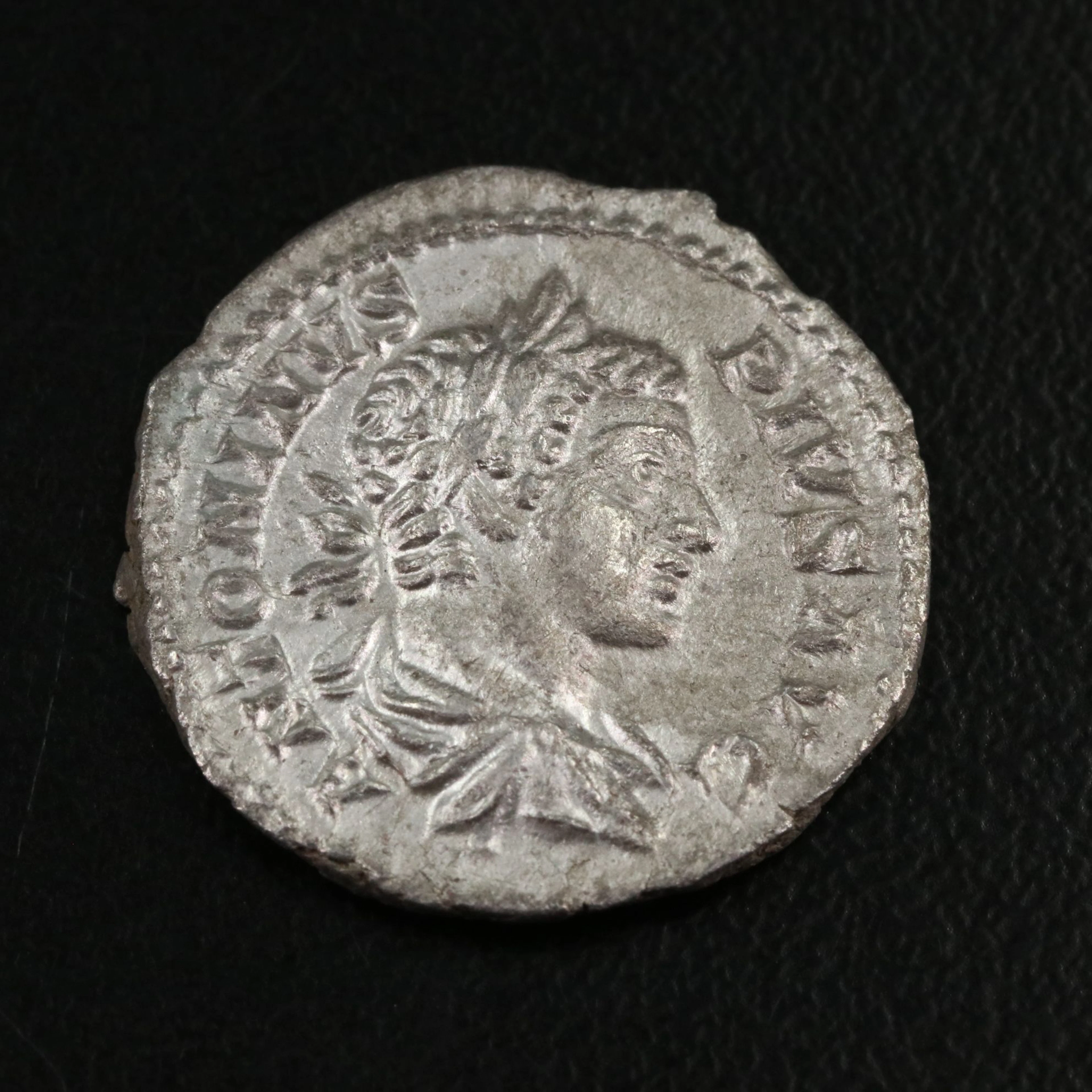 Ancient Roman Imperial AR Denarius Coin of Caracalla, ca. 205 A.D.