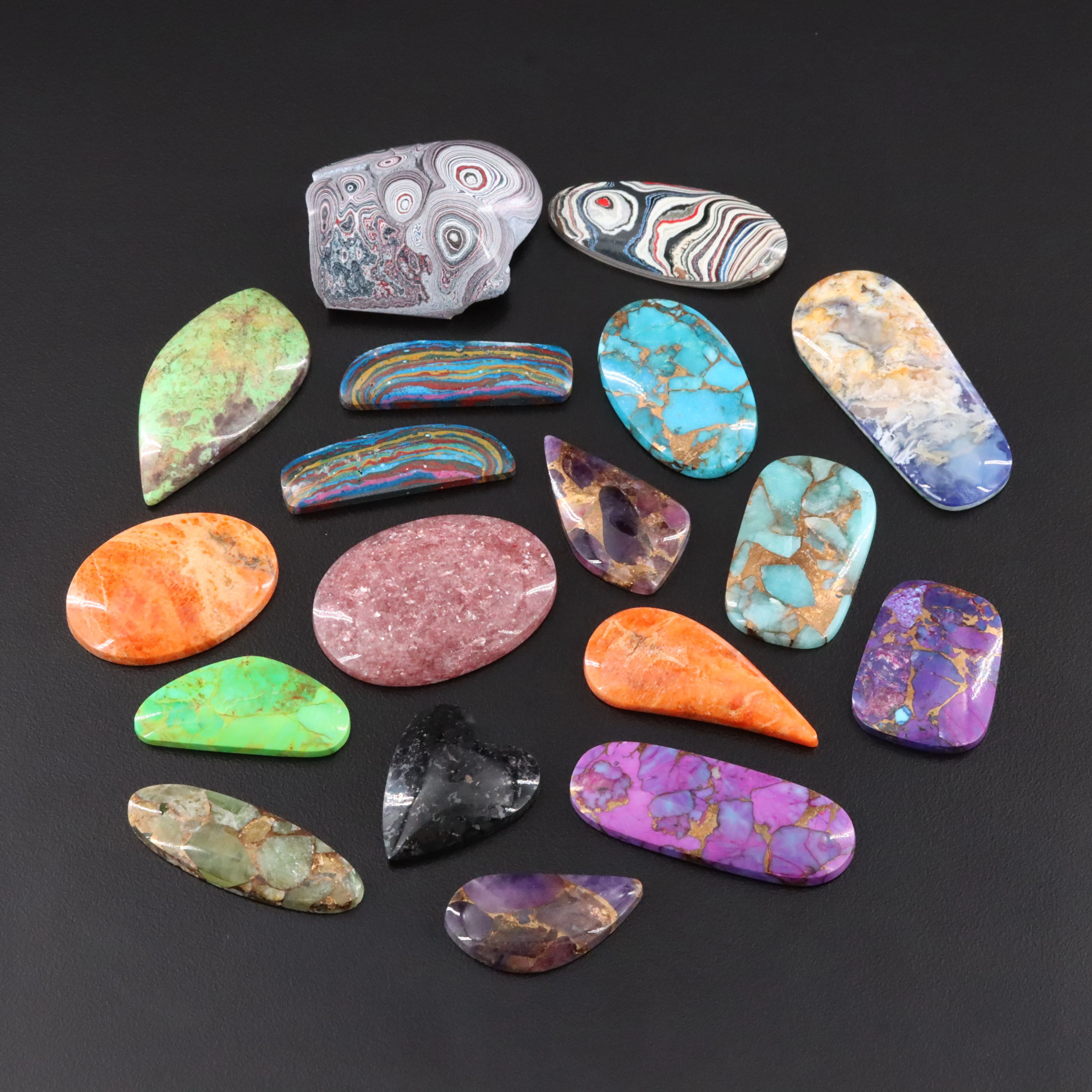 Loose 407.00 CTW Cabochon Lot Featuring Fordite, Larvikite and Gaspeite