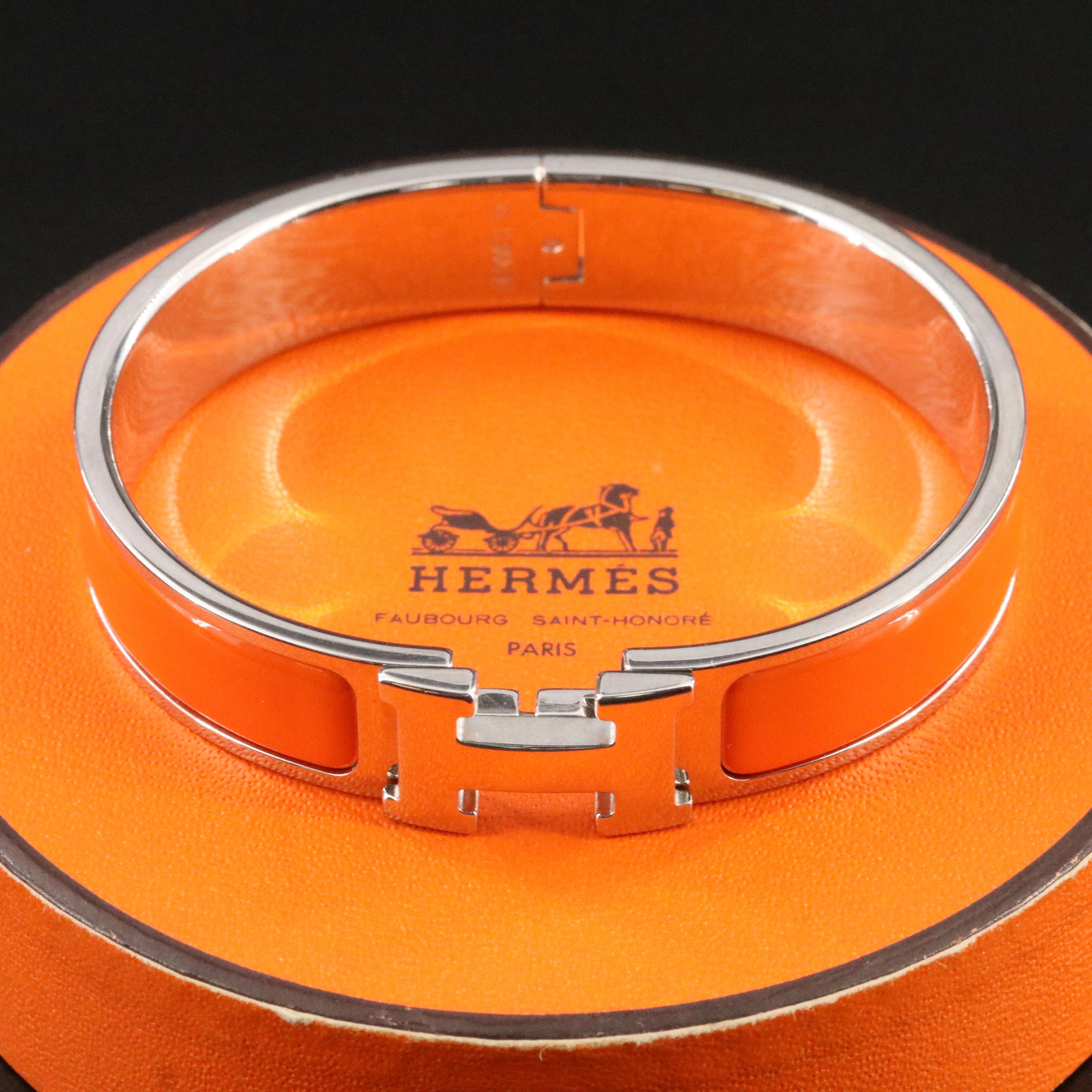 Hermès Clic H Silvertone and Orange Enamel Bracelet