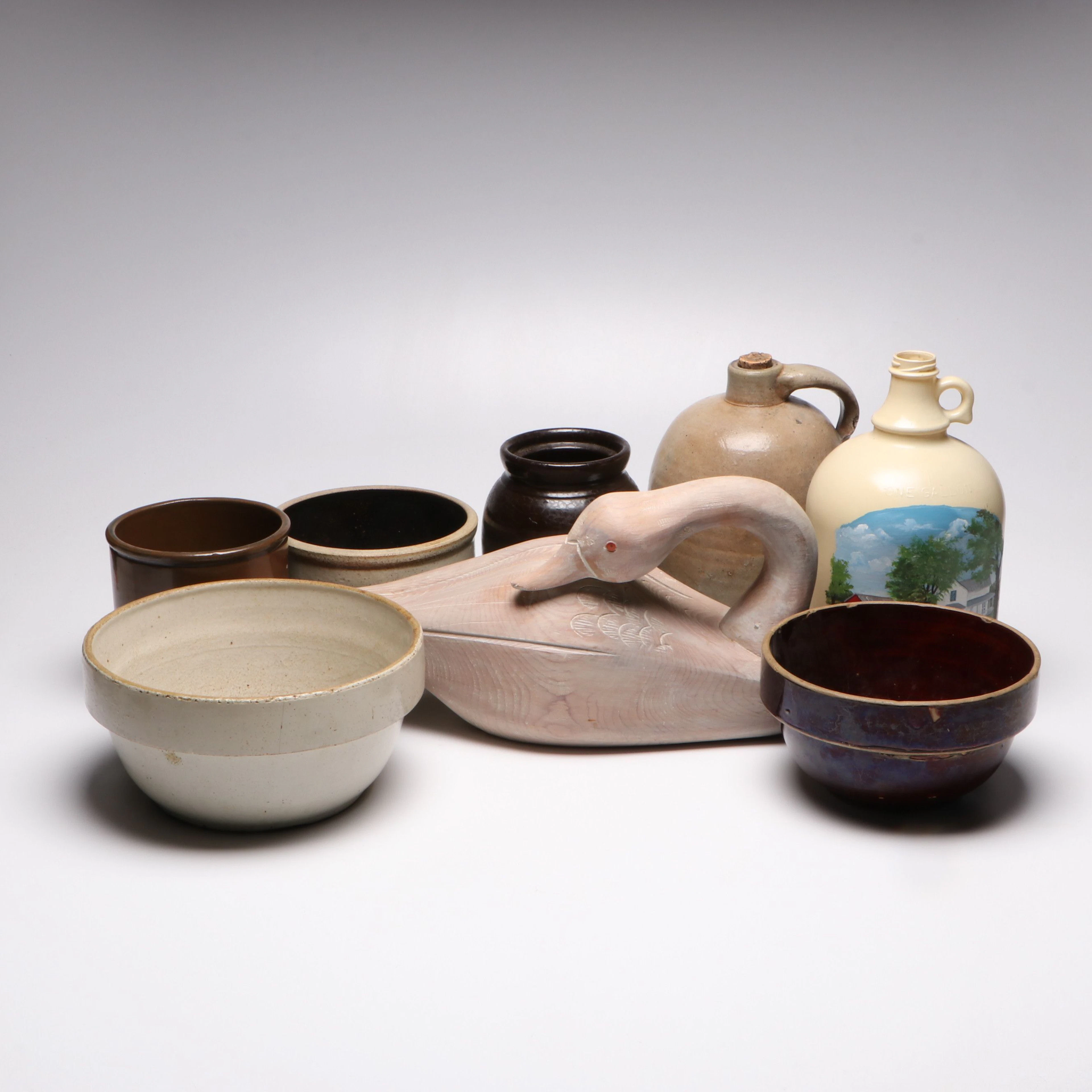 Carved Wooden Decorative Decoy with Stoneware Crocks and Bowls