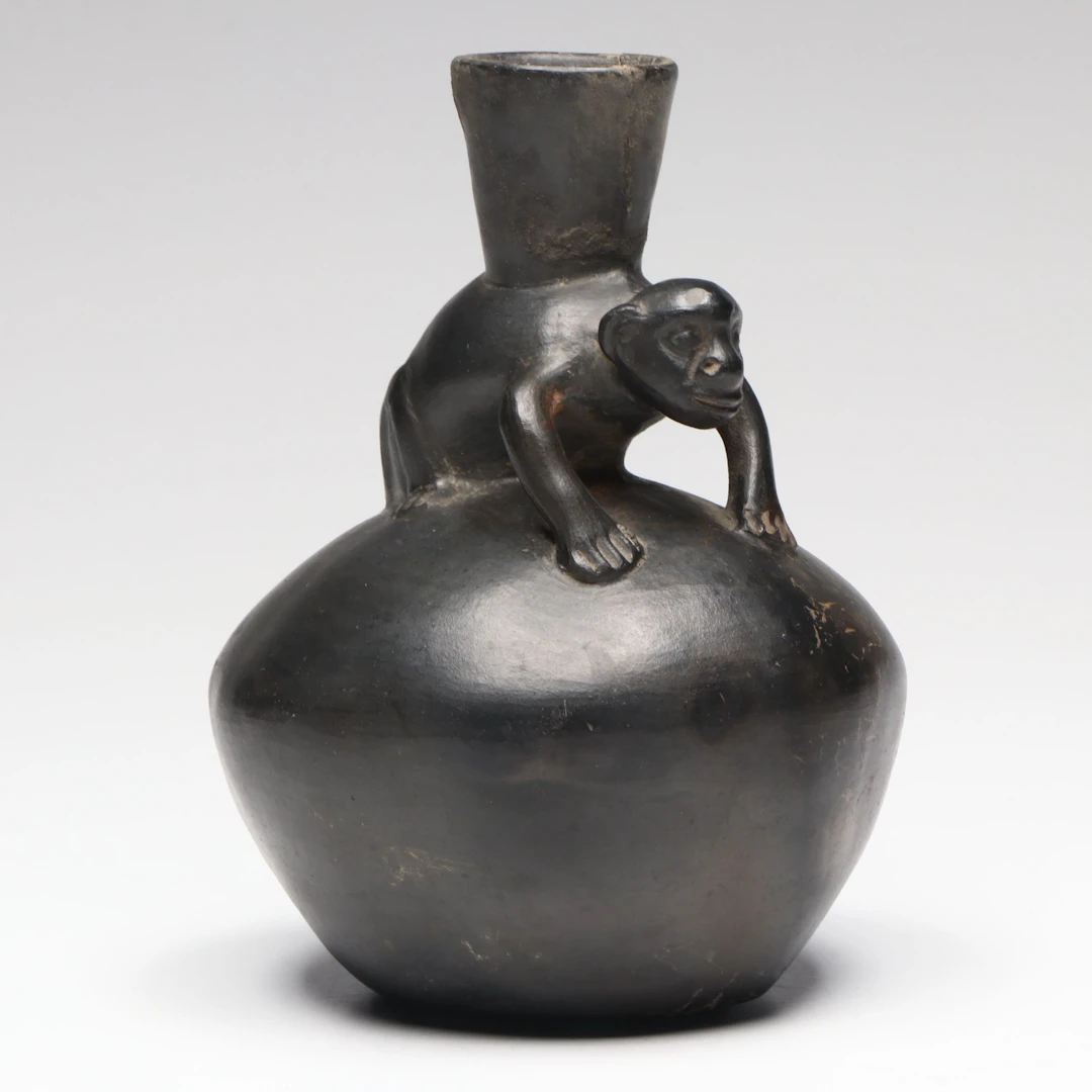 Chimú Inca Blackware Bottle with Modeled Monkey, Circa 1470–1532 CE