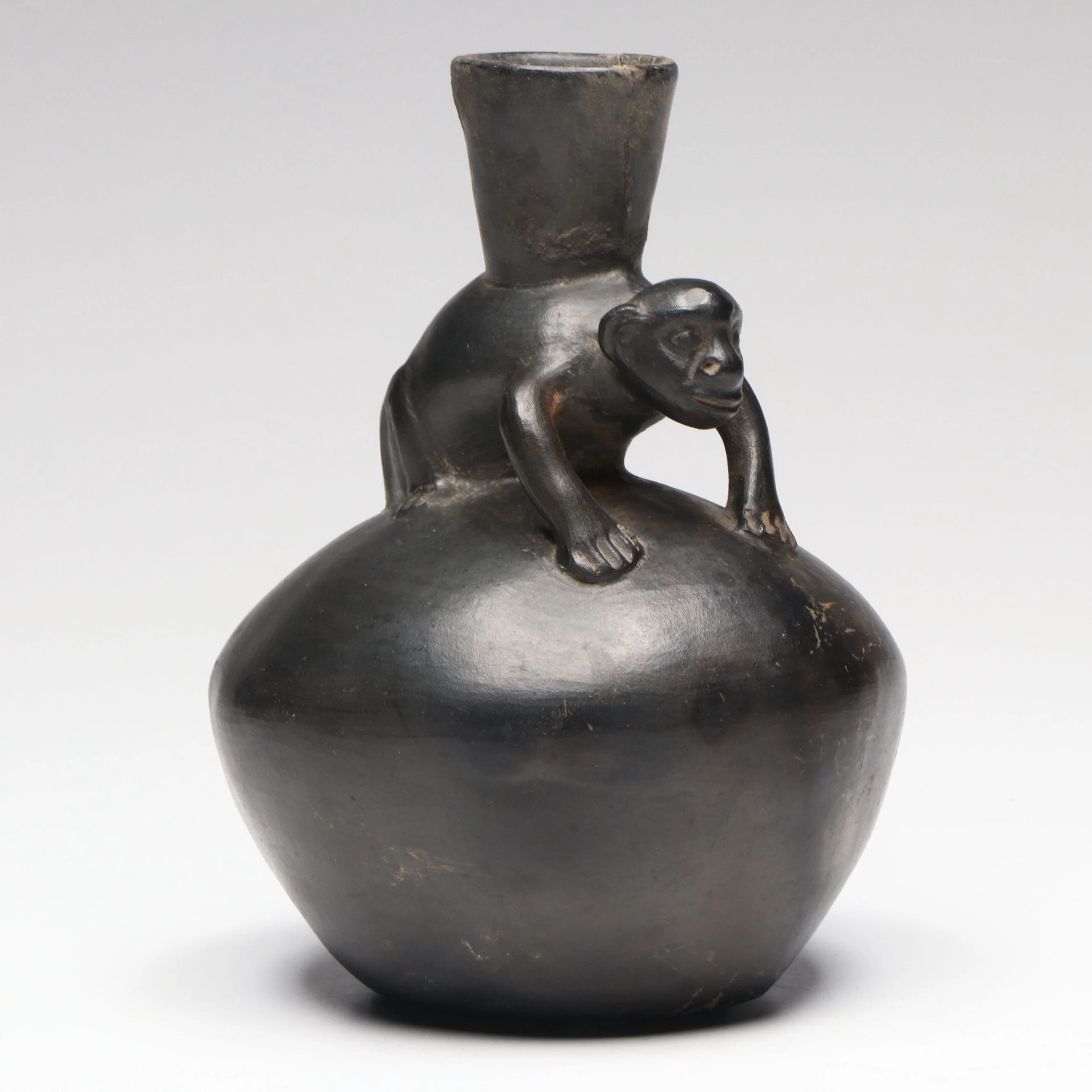 Chimú Inca Blackware Bottle with Modeled Monkey, Circa 1470–1532 CE