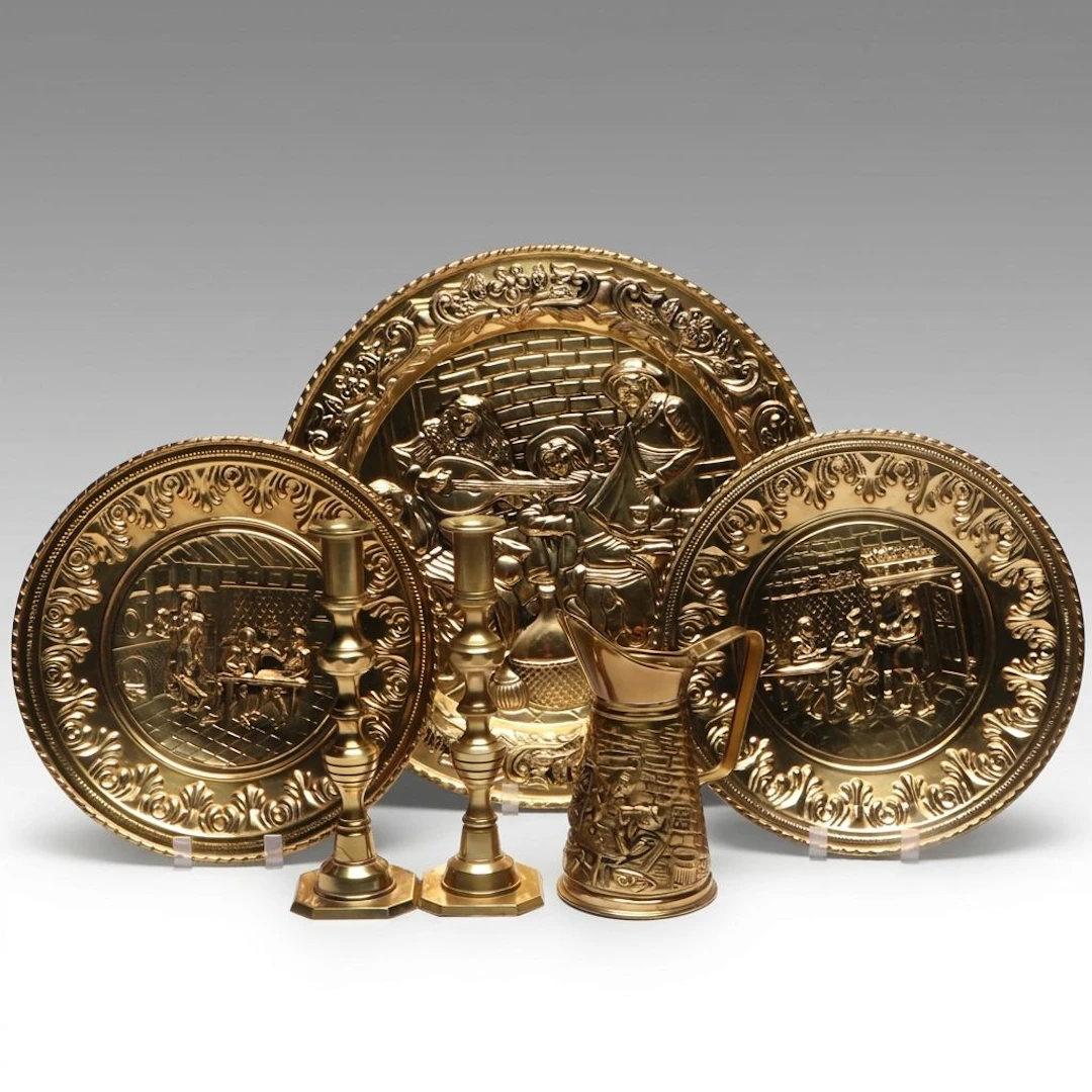 English Embossed Metal Wall Plates and Pitcher with Brass Candlesticks