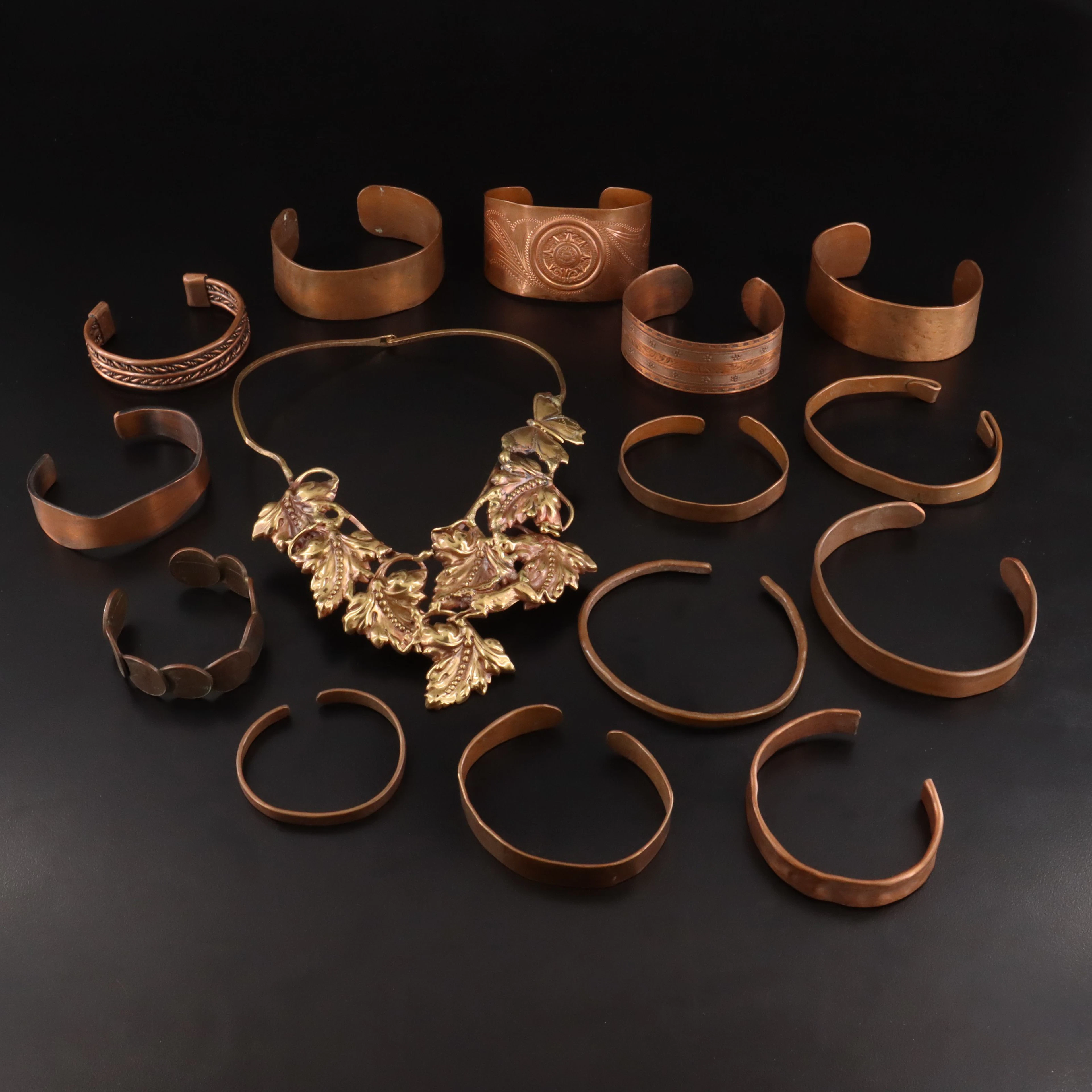 Collection of Copper Bracelets and Rabbit Necklace