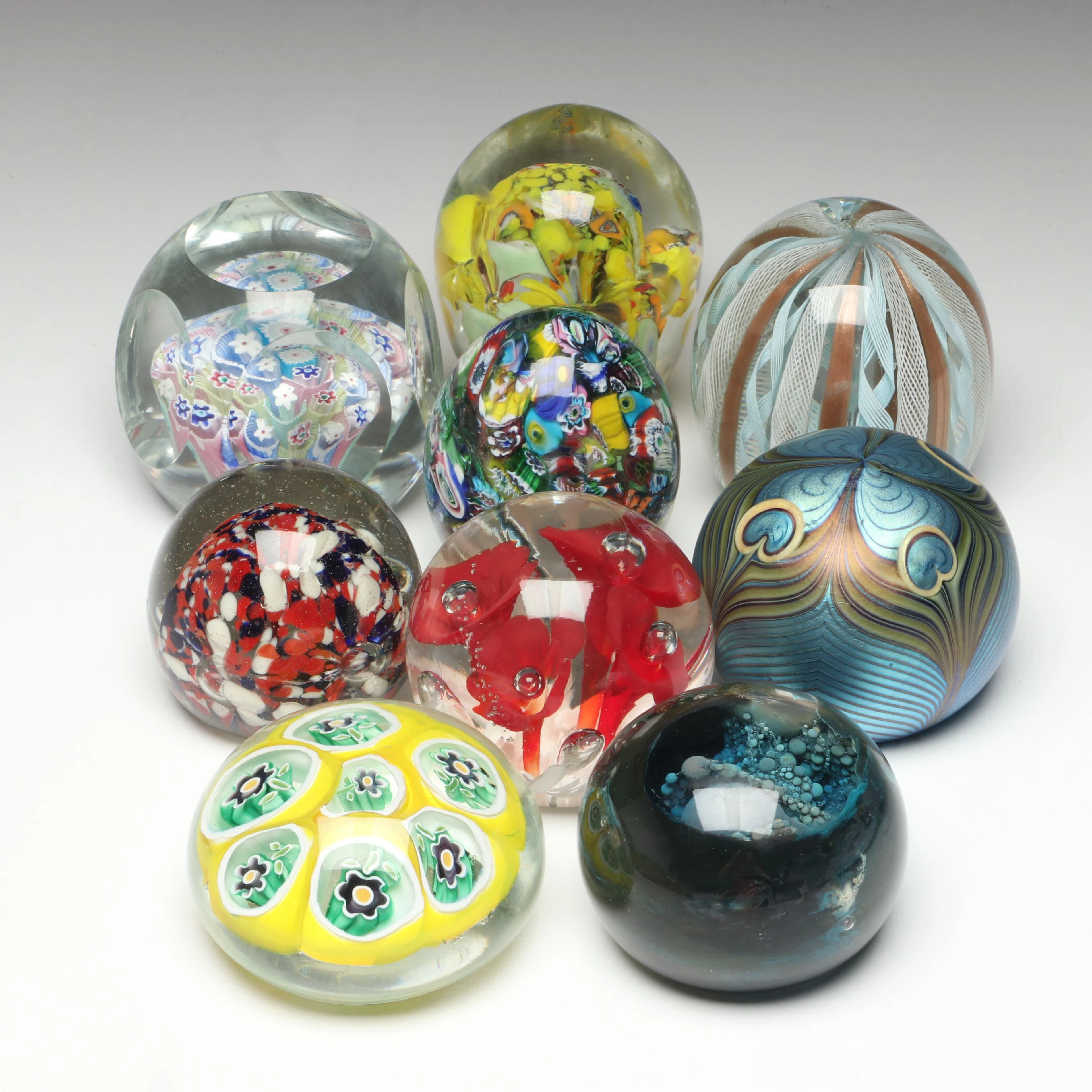 Orient & Flume Feathered Glass Paperweight with Other Art Glass Paperweights