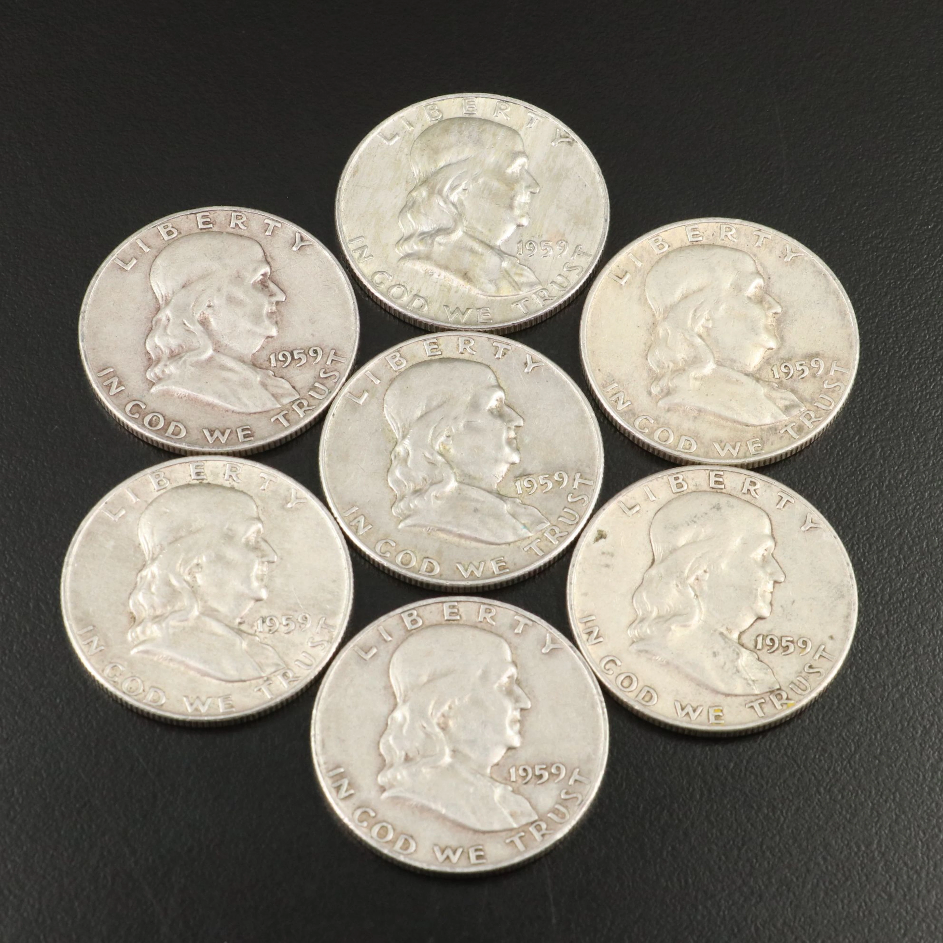 Seven 1959 and 1959-D Franklin Silver Half Dollars