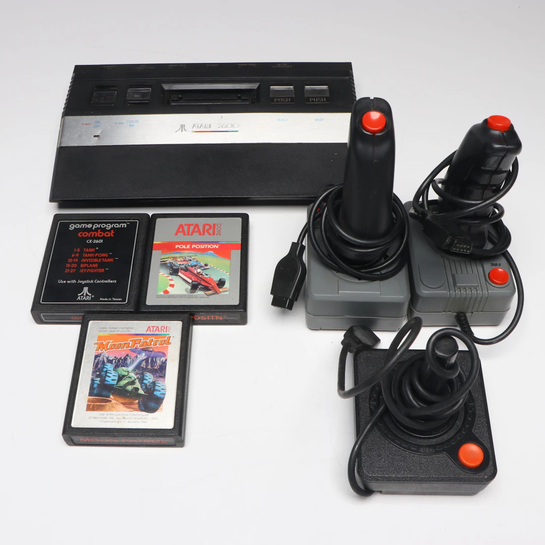 Atari 2600 Video Game Console with Controllers and Games, 1980s