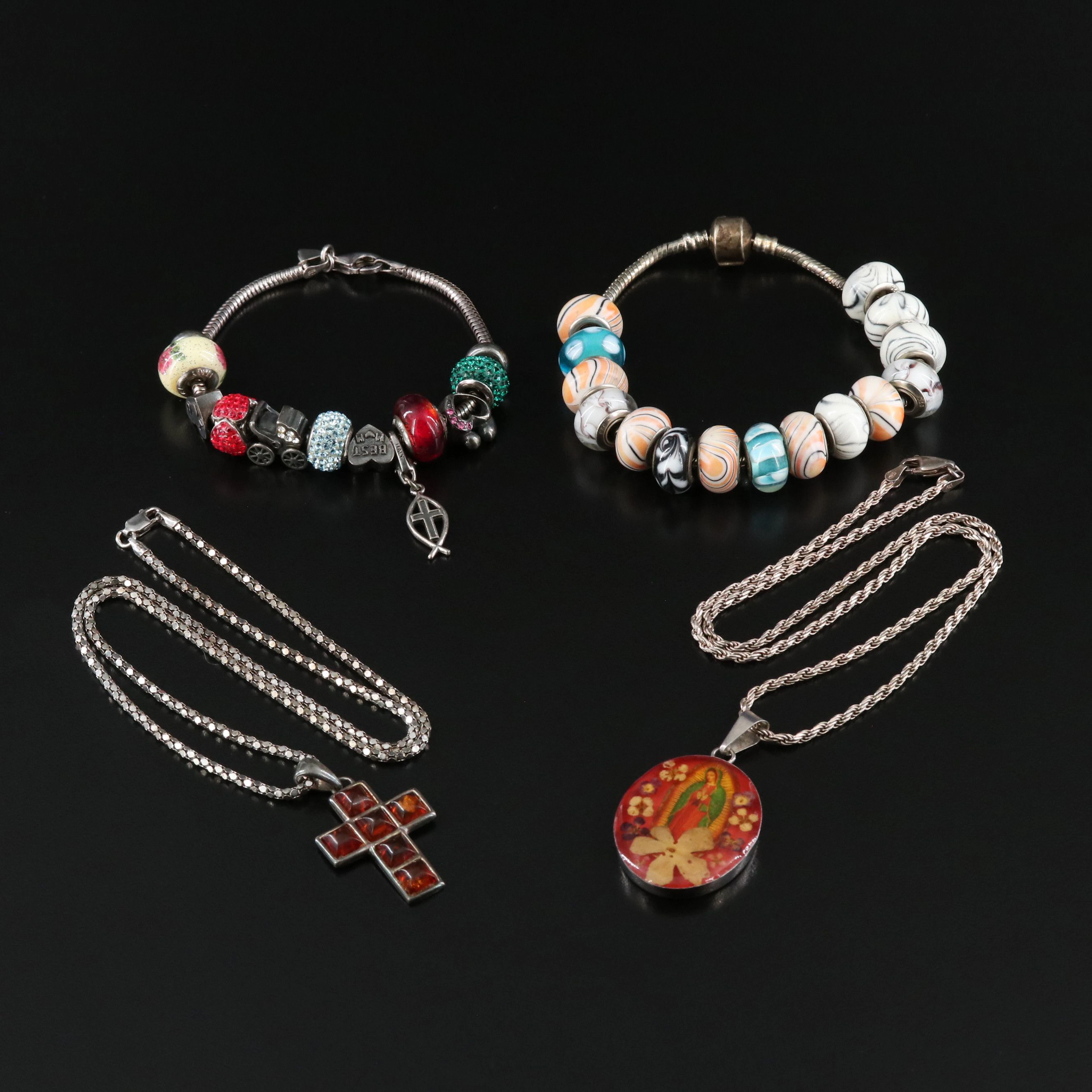 Charms, Amber and Our Lady of Guadalupe Featured in Sterling Jewelry
