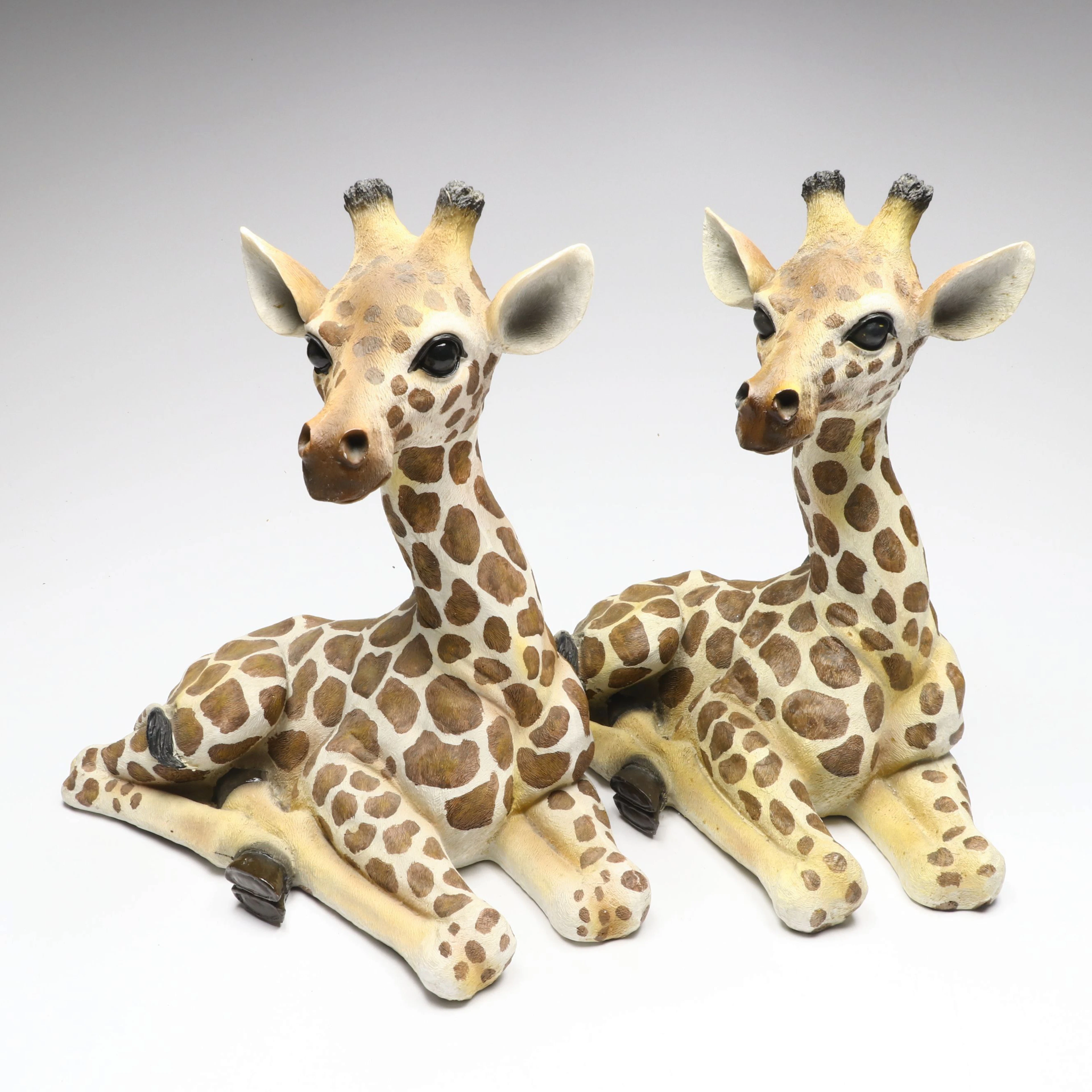 Pair of Kirkland's Reclining Baby Giraffe Resin Sculptures