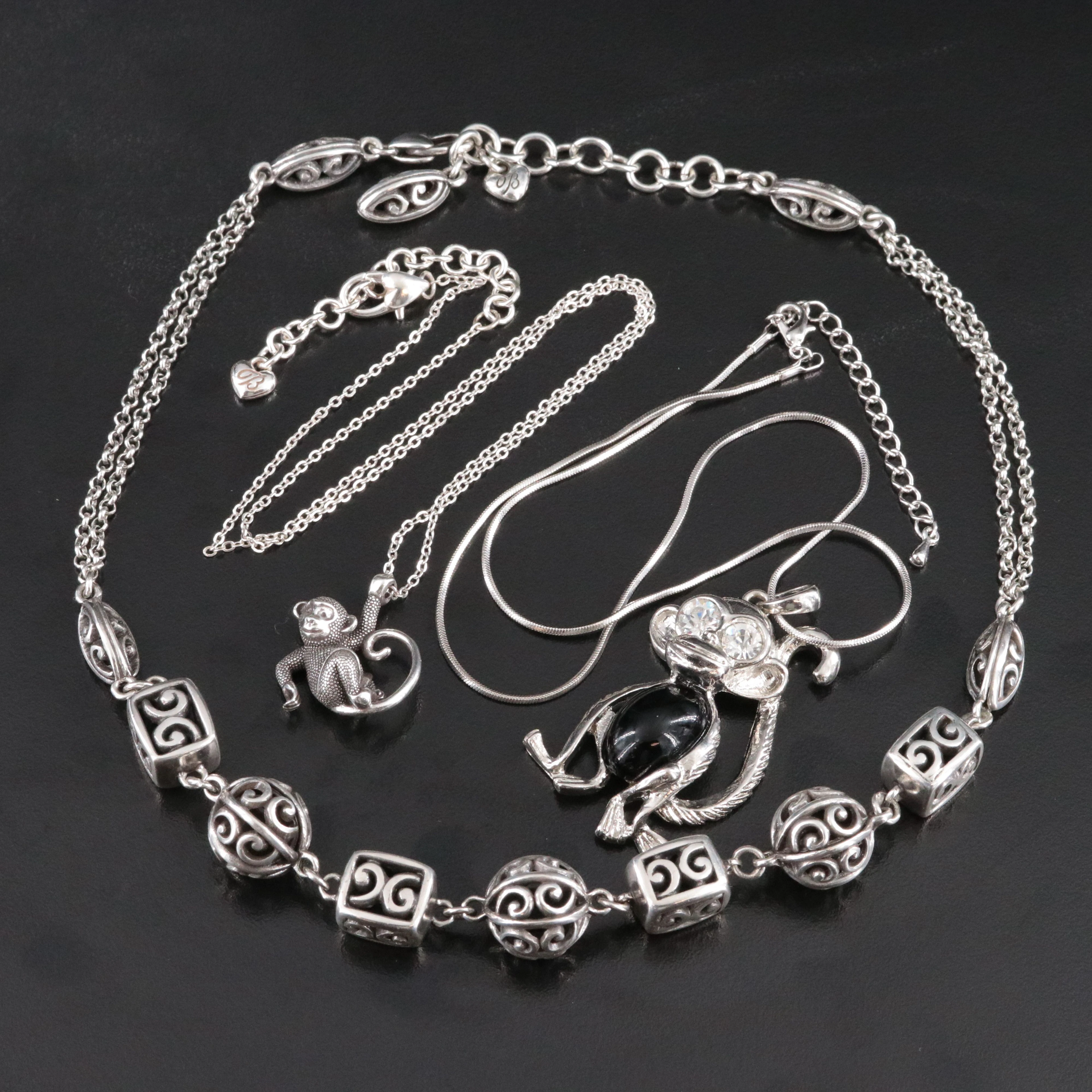Monkey and Scroll Motif Necklaces Featuring Brighton