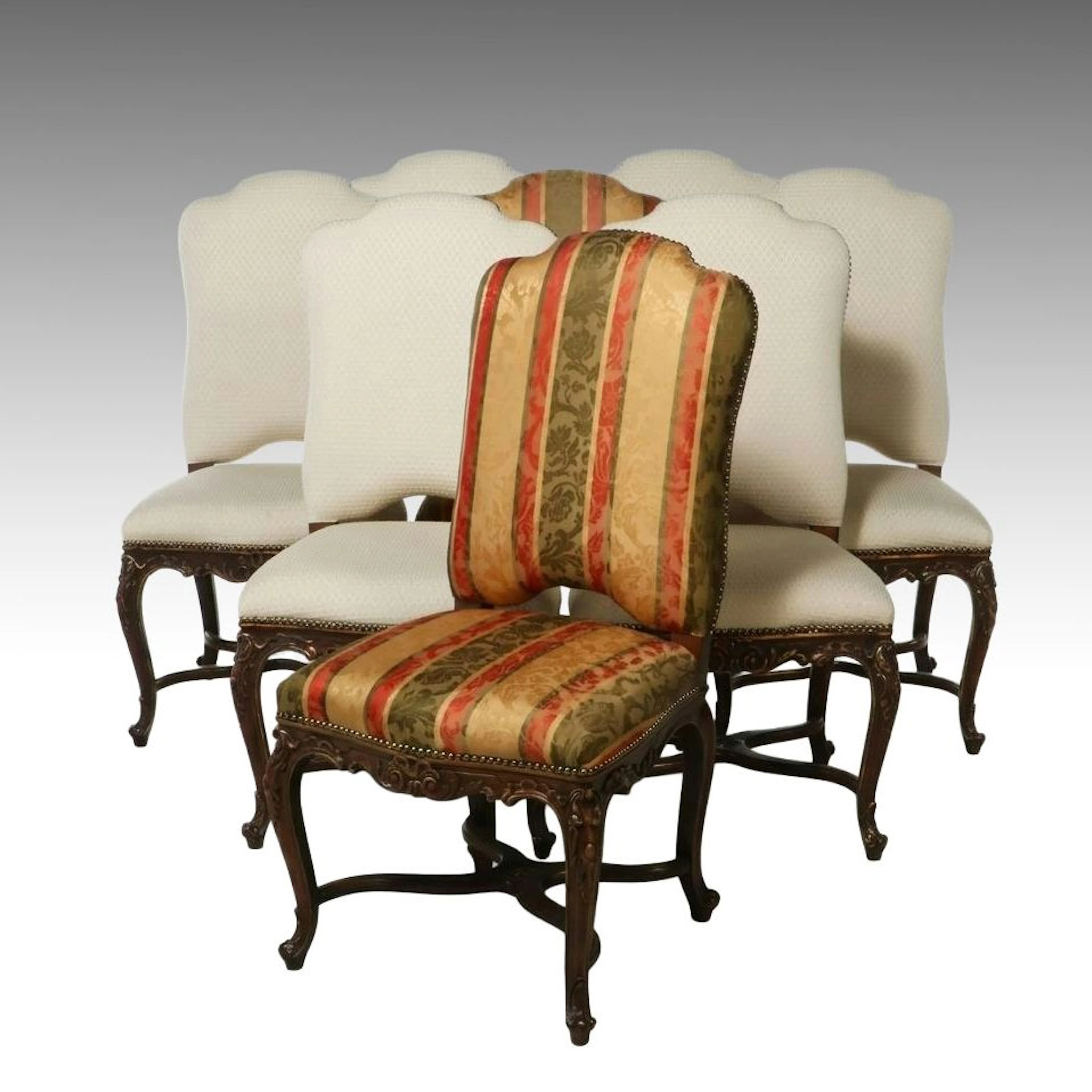 Set of Eight French Rococo Style Carved Wood and Upholstered Dining Chairs