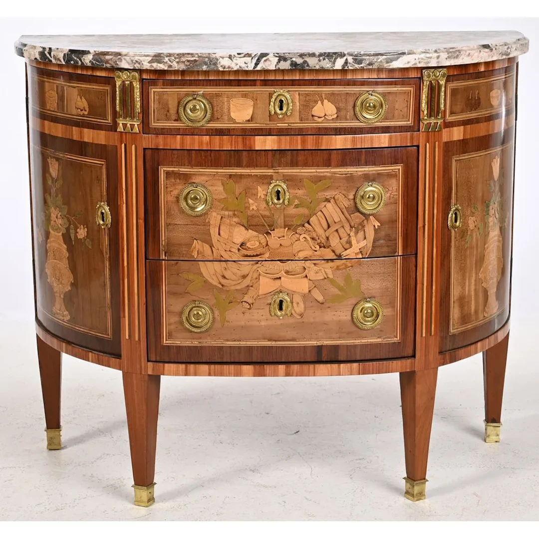 ONHEBERG. Louis XVI half-moon chest of drawers made of precious wood