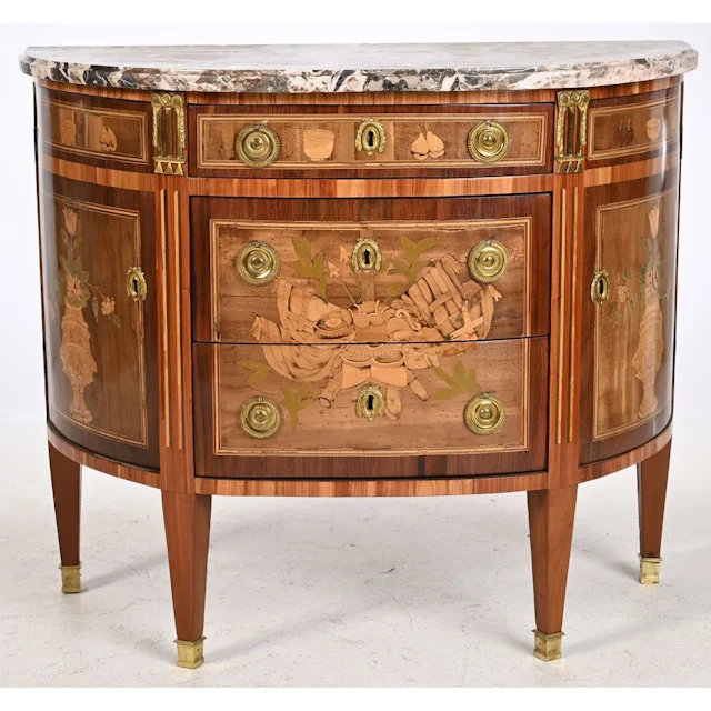 ONHEBERG. Louis XVI half-moon chest of drawers made of precious wood