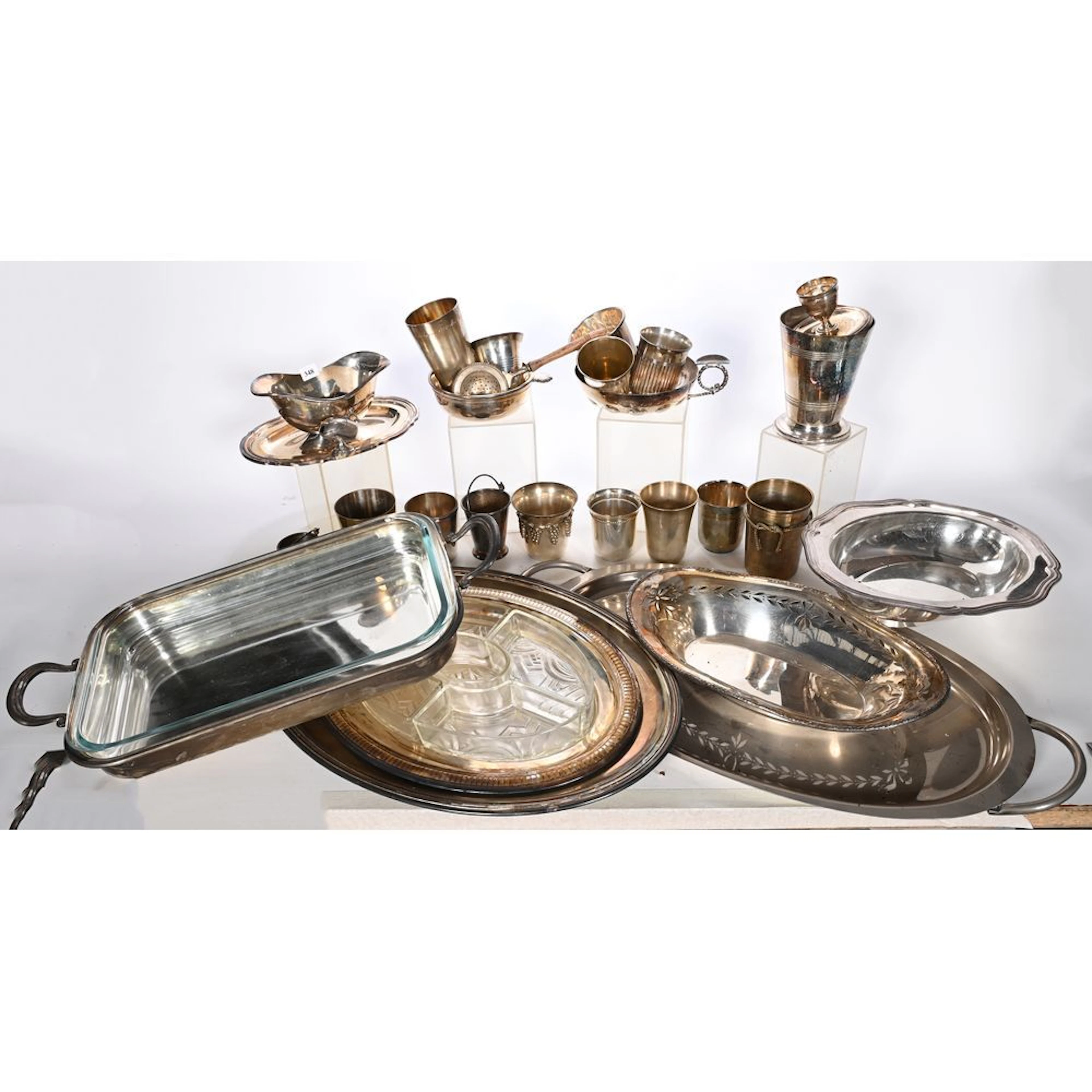 A silver plated metal set including serving platters, a tastevin