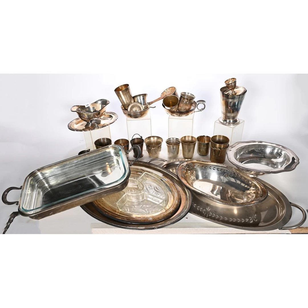 A silver plated metal set including serving platters, a tastevin