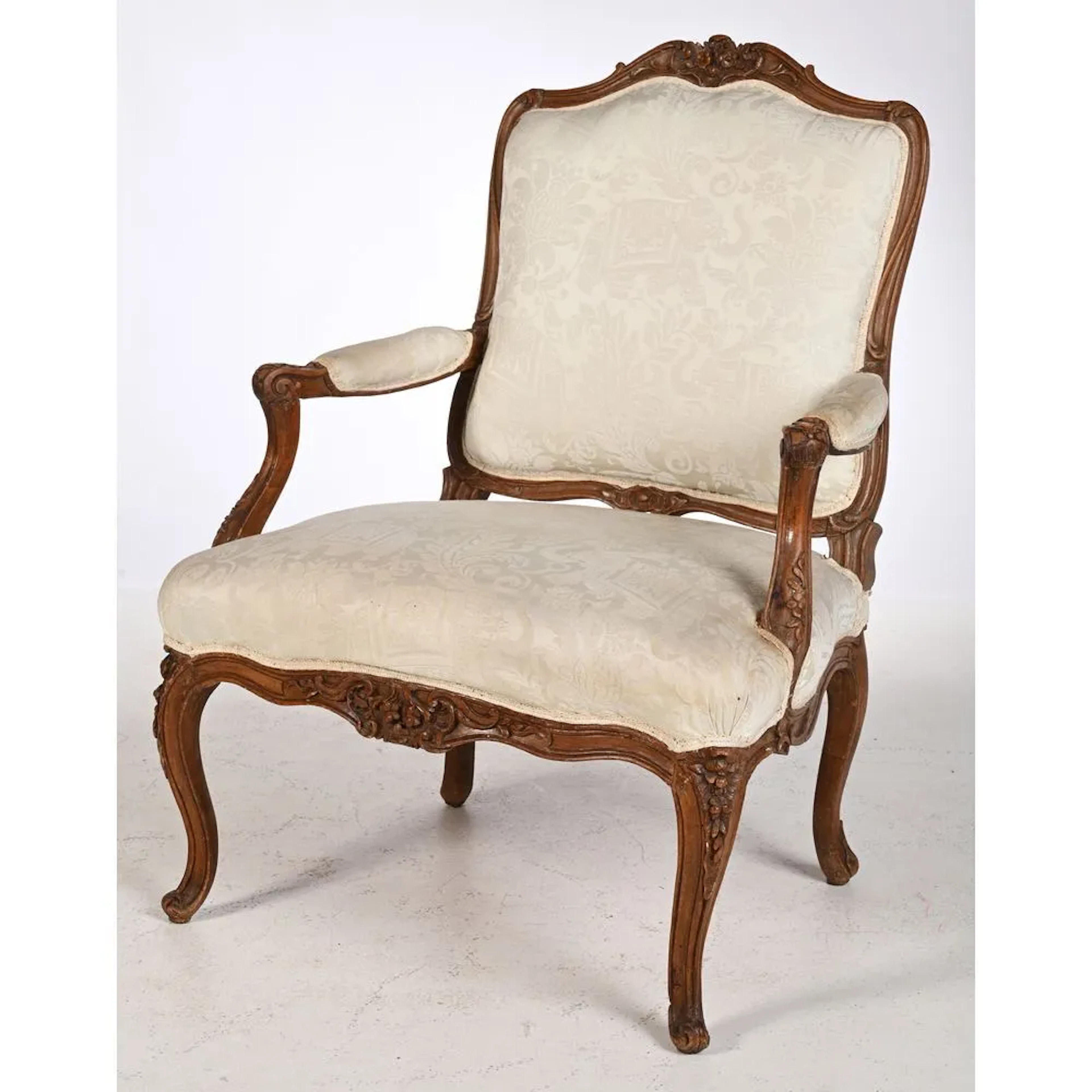 LARGE LOUIS XV ARMCHAIR WITH A FLAT BACK, featuring a curvilinear