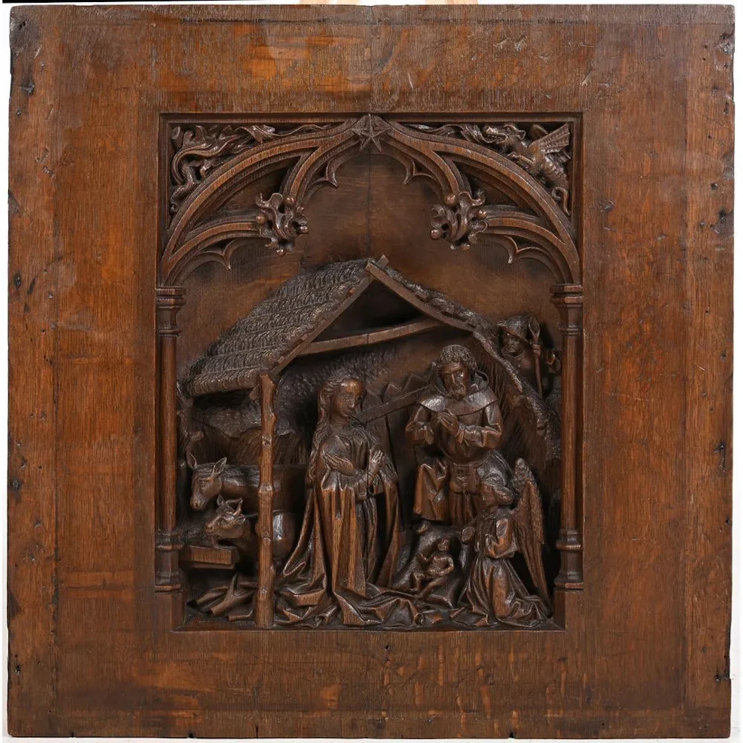 Oak PANEL depicting a Nativity scene carved in high relief. Various