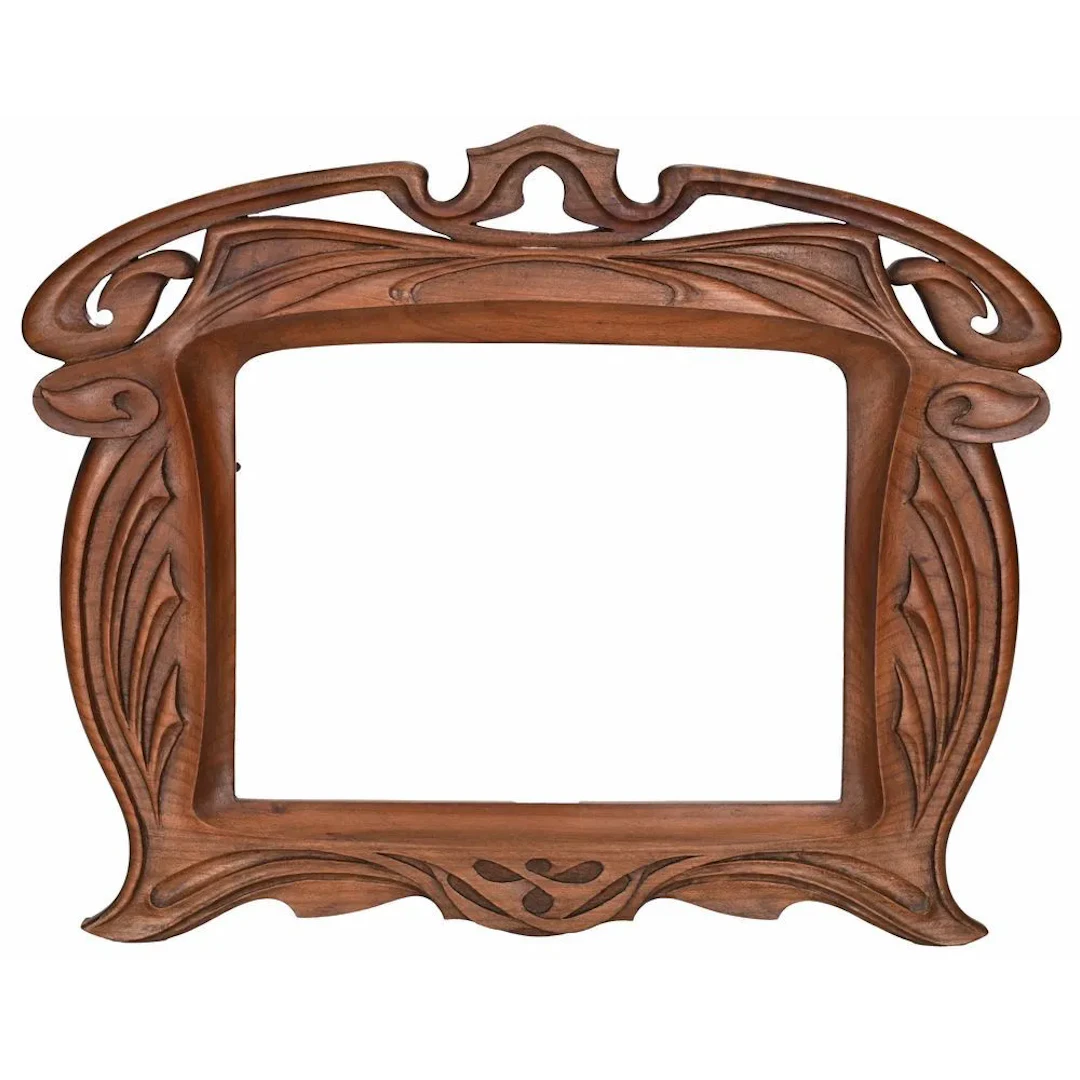 BEAUTIFUL ART NOUVEAU FRAME in walnut with naturalistic motifs. Circa