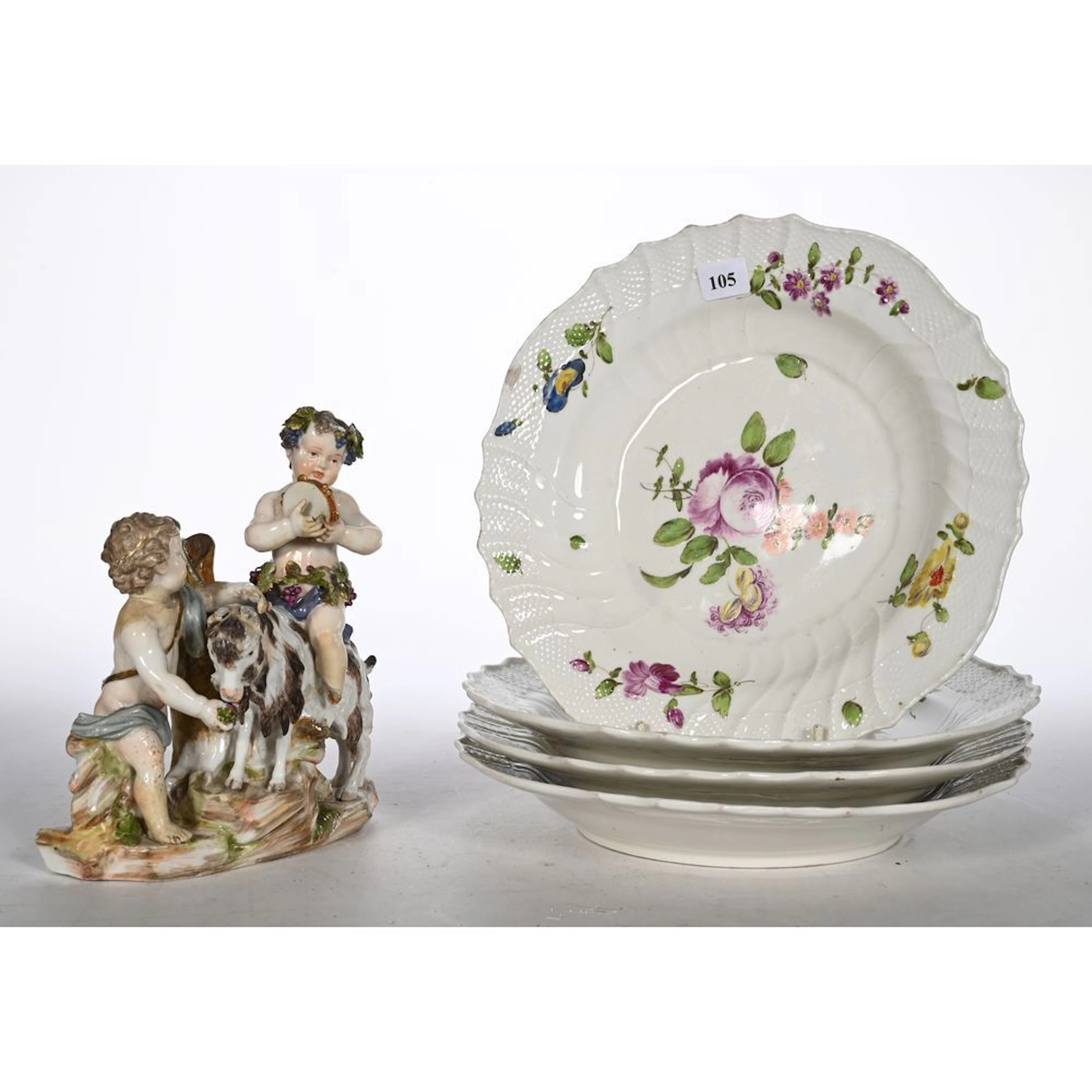 VIENNA. SET OF 4 porcelain soup plates with polychrome floral decoration.