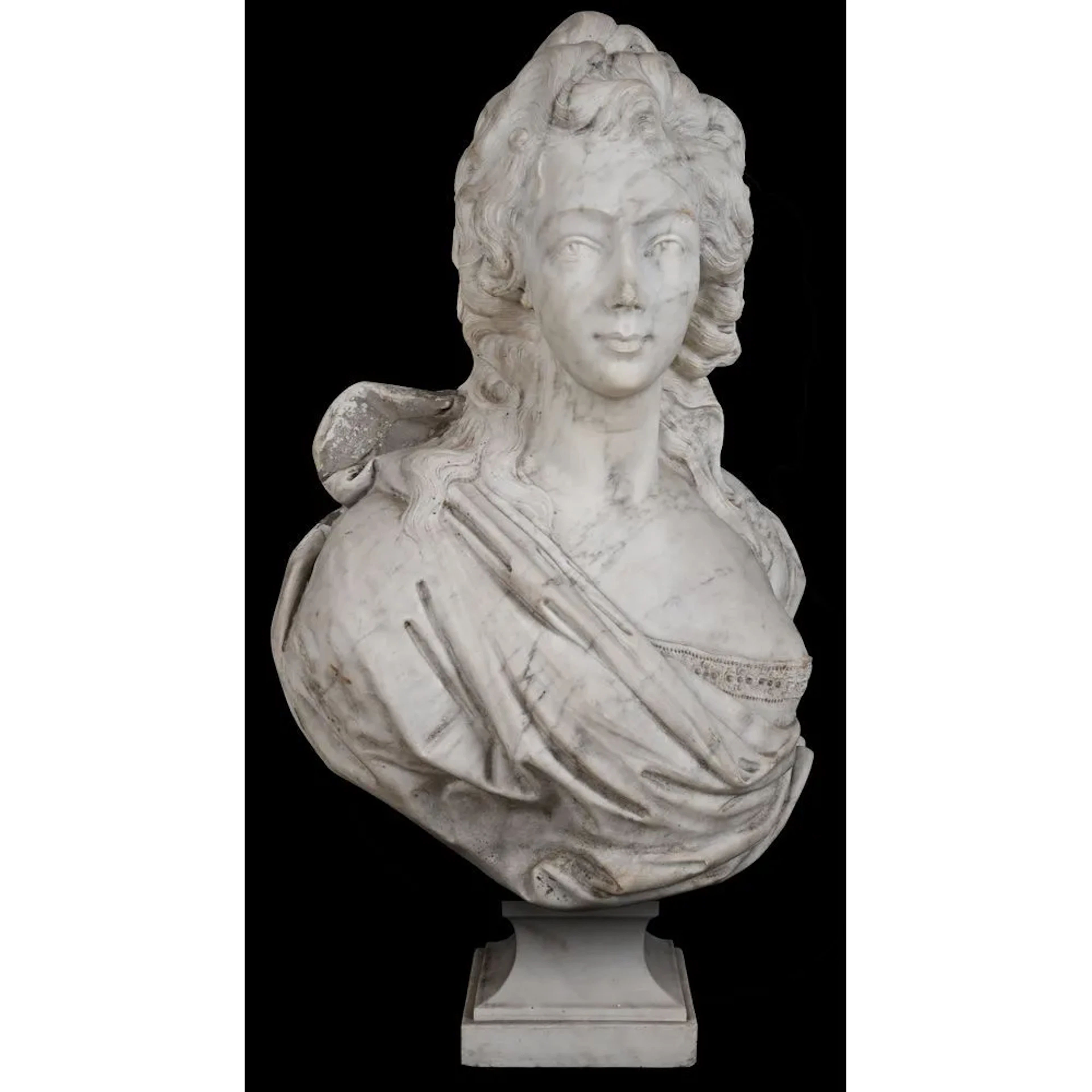 A marble sculpture, likely made of Carrara marble, depicting the bust