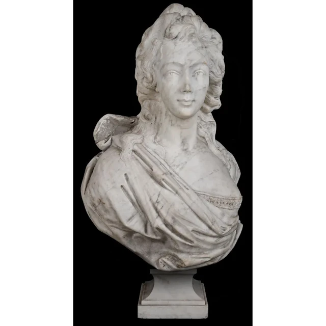 A marble sculpture, likely made of Carrara marble, depicting the bust
