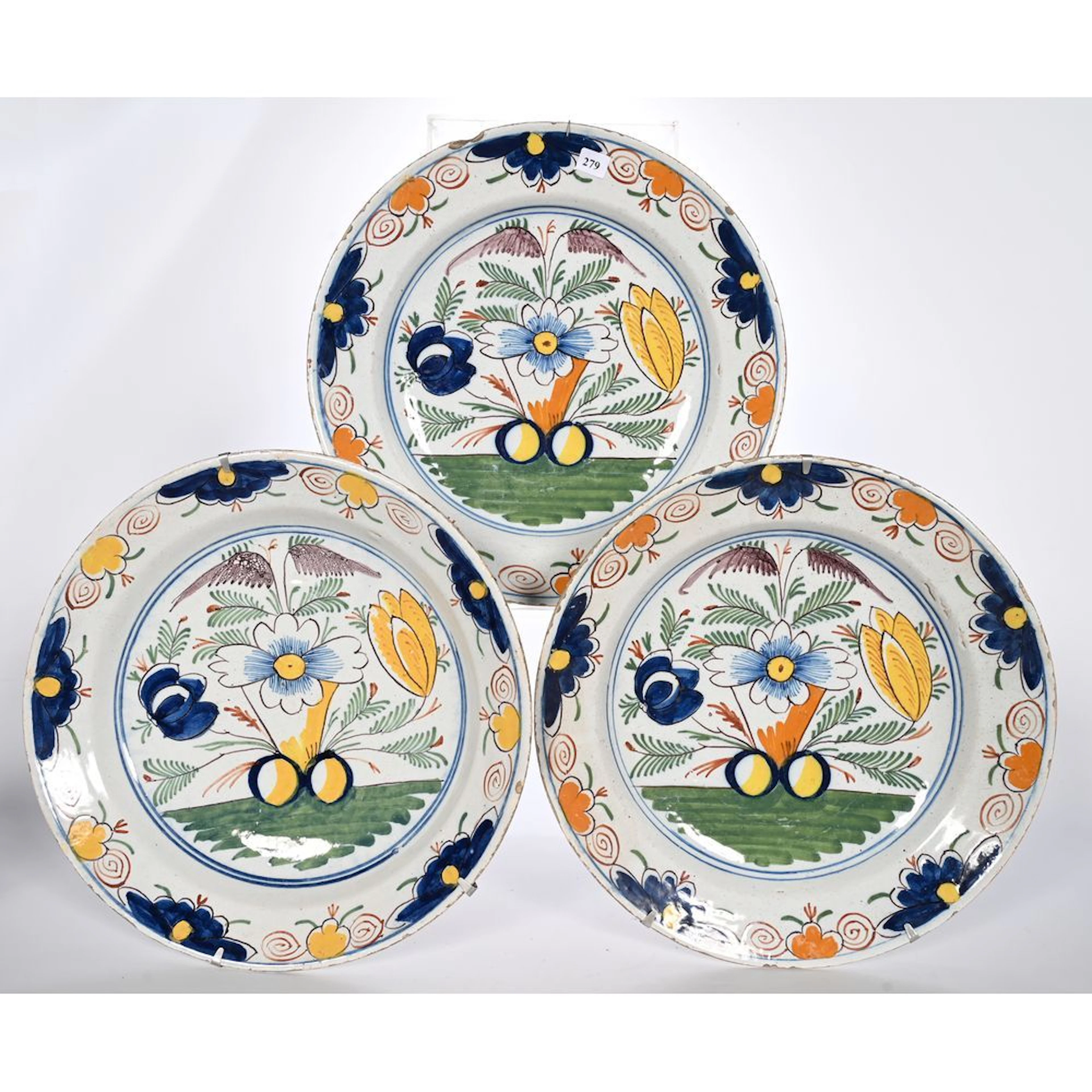 DELFT. 3-PIECE CERAMIC SET decorated with stylized foliage. (Chips